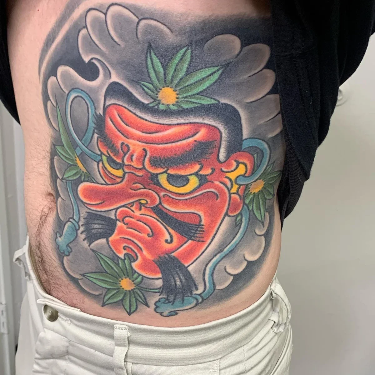 Large scale red Tengu ribs to stomach. Full color with wind bars, kiku and botan behind it. Built for flow - chest, ribs, stomach in one piece.
