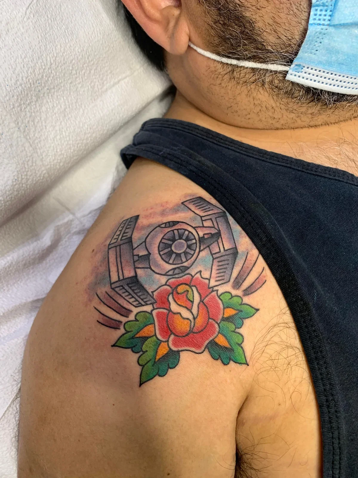 Pop-culture trad — Imperial TIE fighter hovering over classic red rose and green leaves. Galaxy background.
