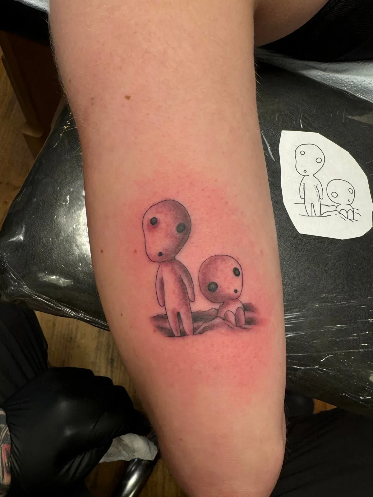 Cute black and gray Kodama forest spirits from Studio Ghibli's Princess Mononoke. Whimsical anime tattoo with soft shading by Brett Semrick in San Diego.