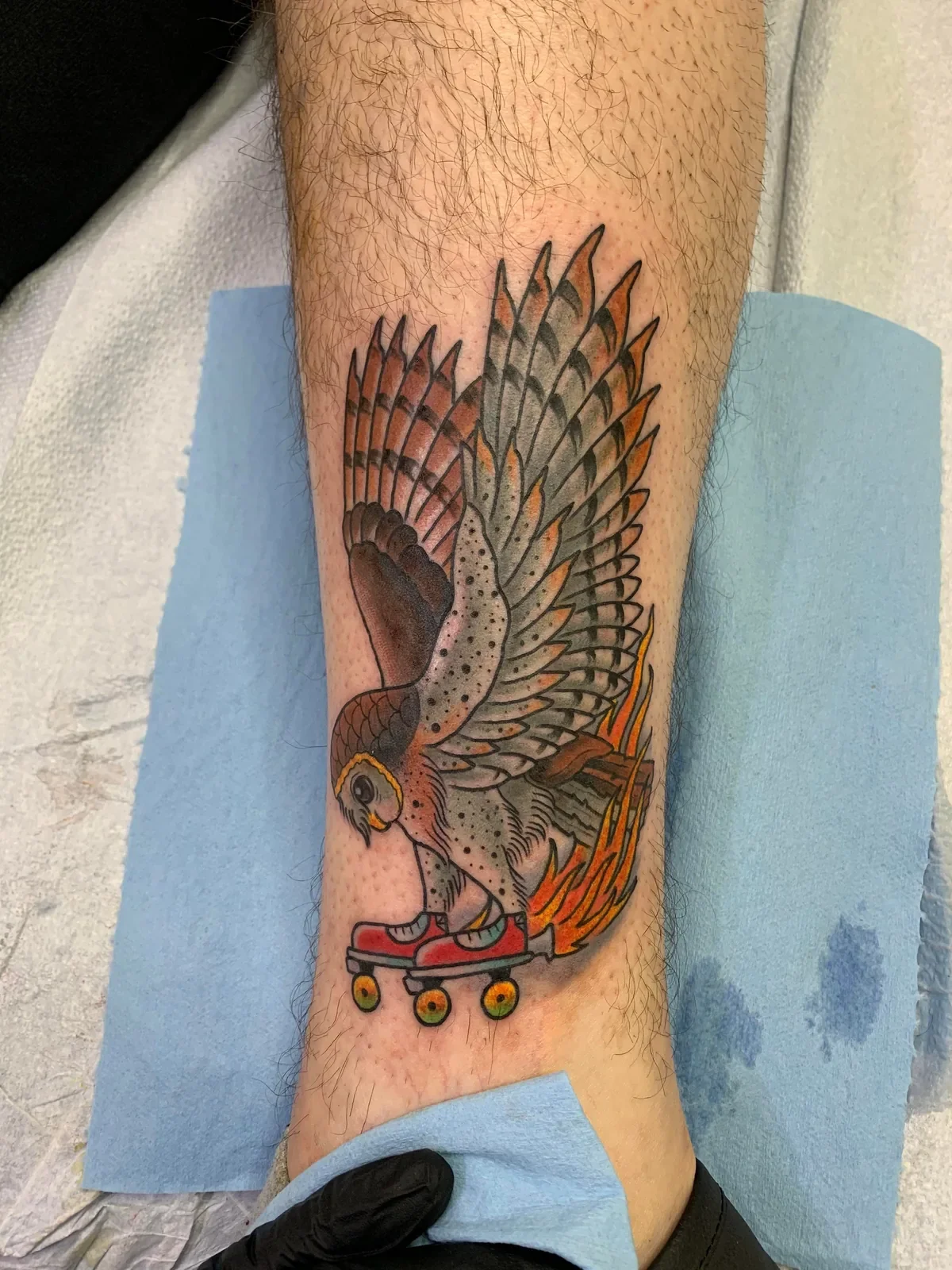 Roller-skating barn owl with flames — red skates, muted browns and oranges. Fun, weird, trad.
