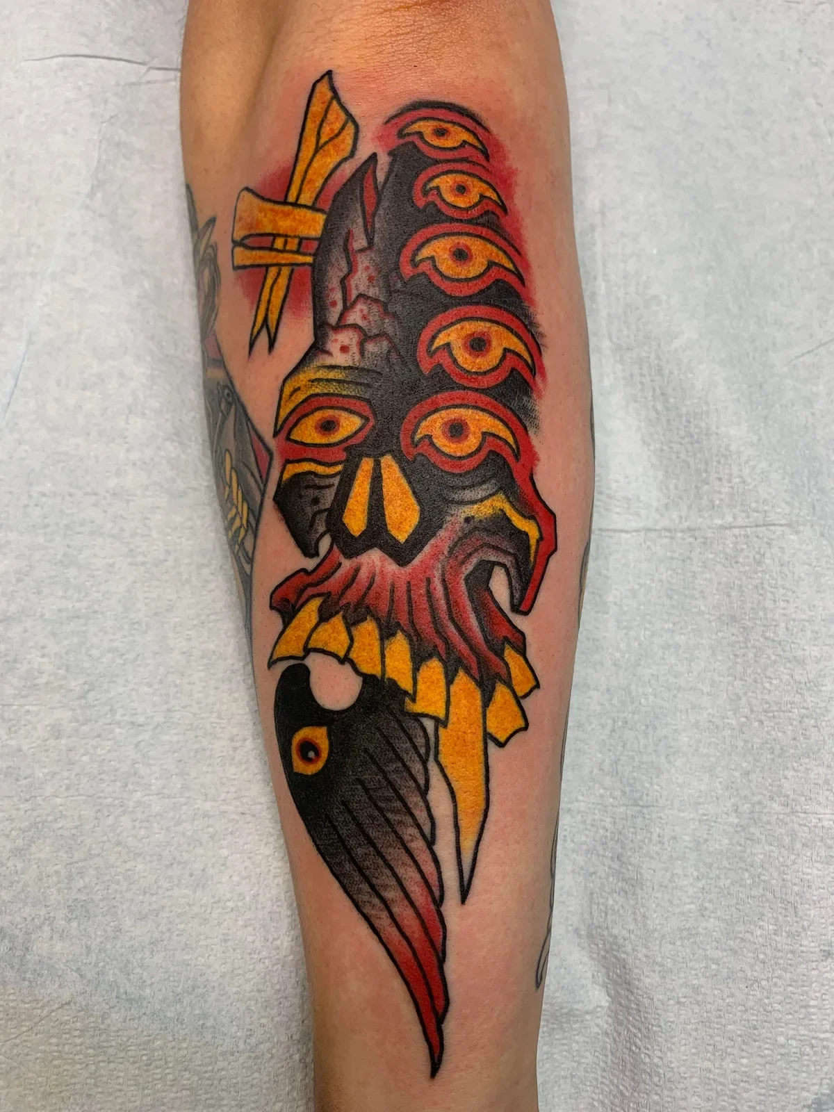 Custom dark trad abstract — stacked eyes, split skull, . Red, gold, and black palette.
