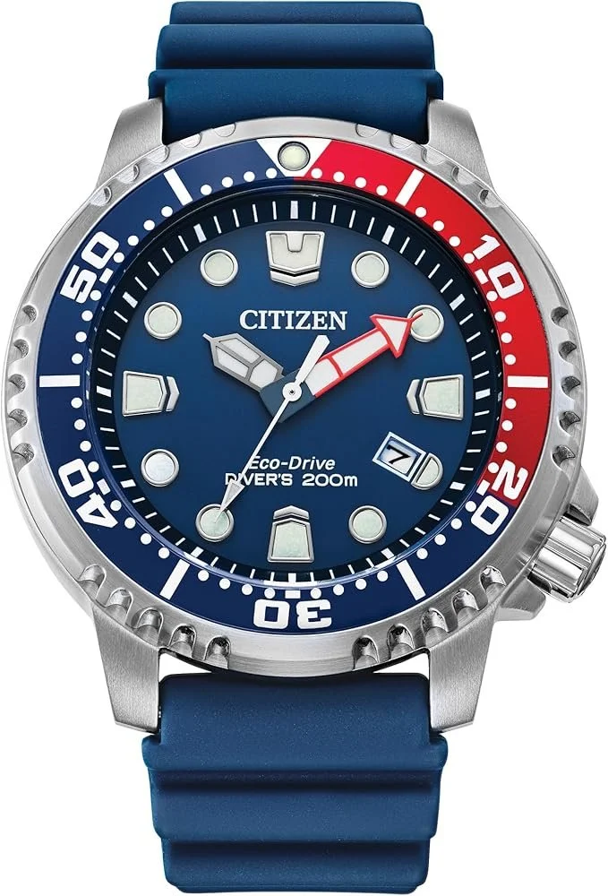 Blue Citizen Eco-Drive diver's watch with a red and blue bezel, blue strap, and large markers.