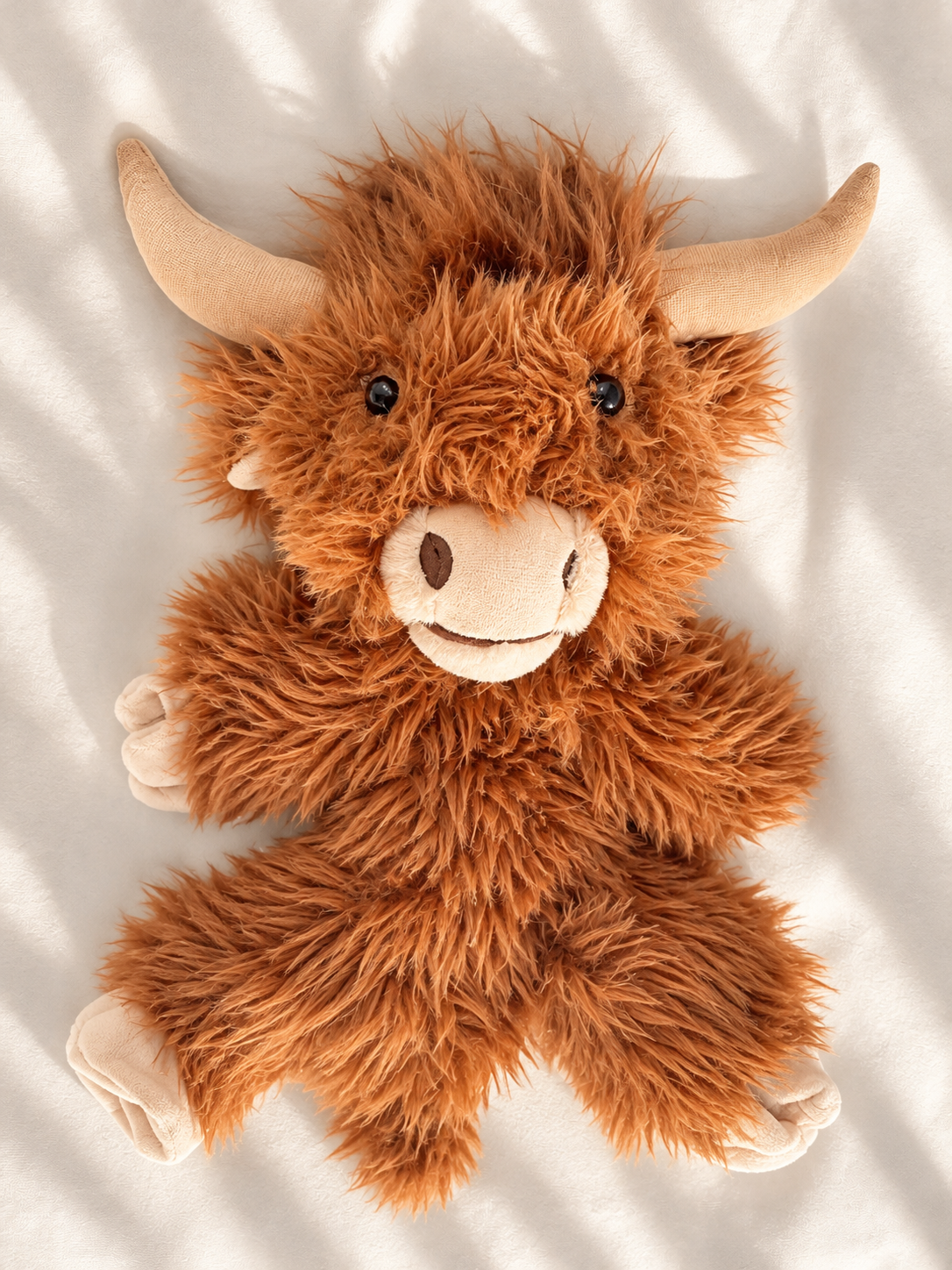 Shaggy Highland Cow Plush in Sunlight.png