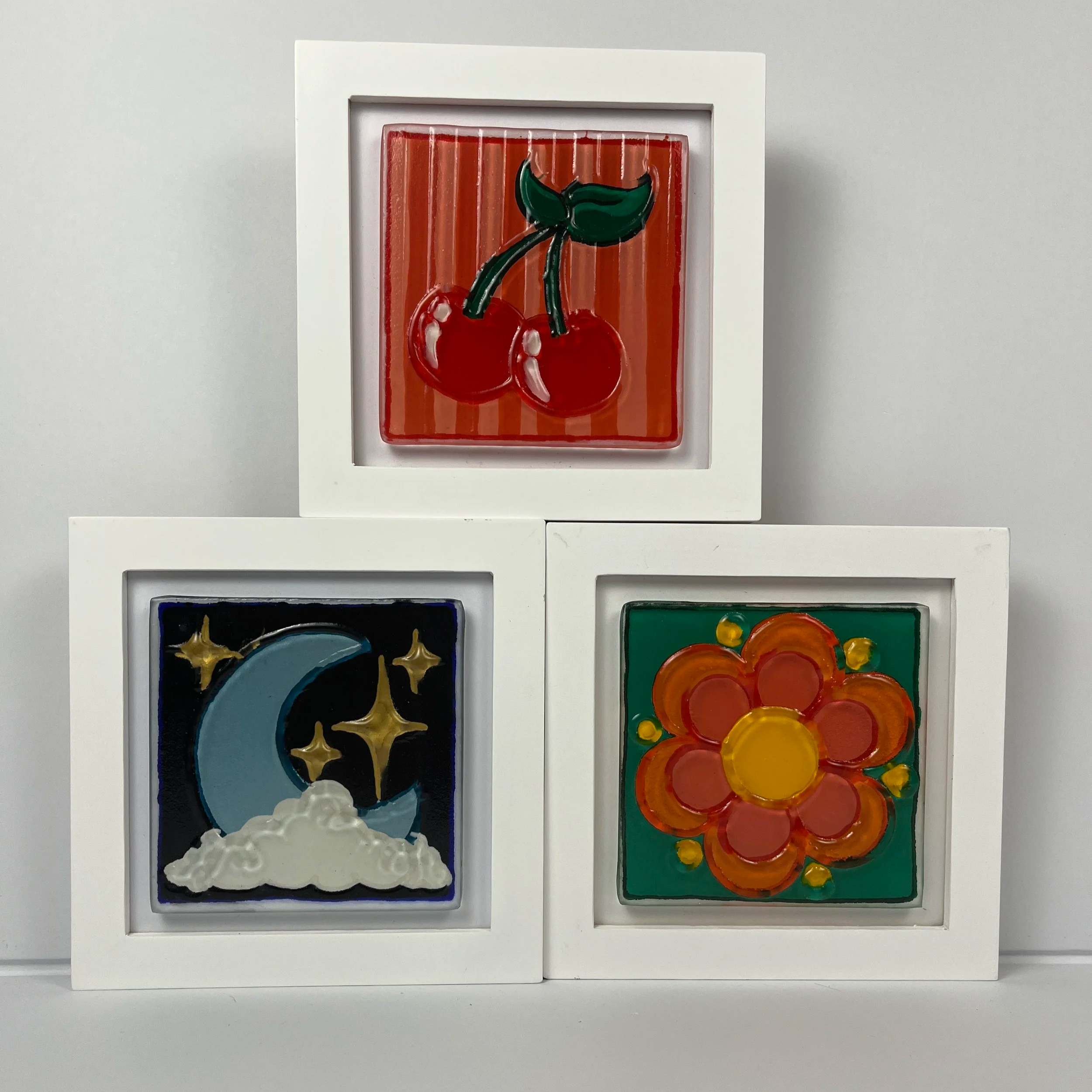 Mini tile framed textured glass art wall art hand painted with fun designs like moons, stars, flowers, and fruit