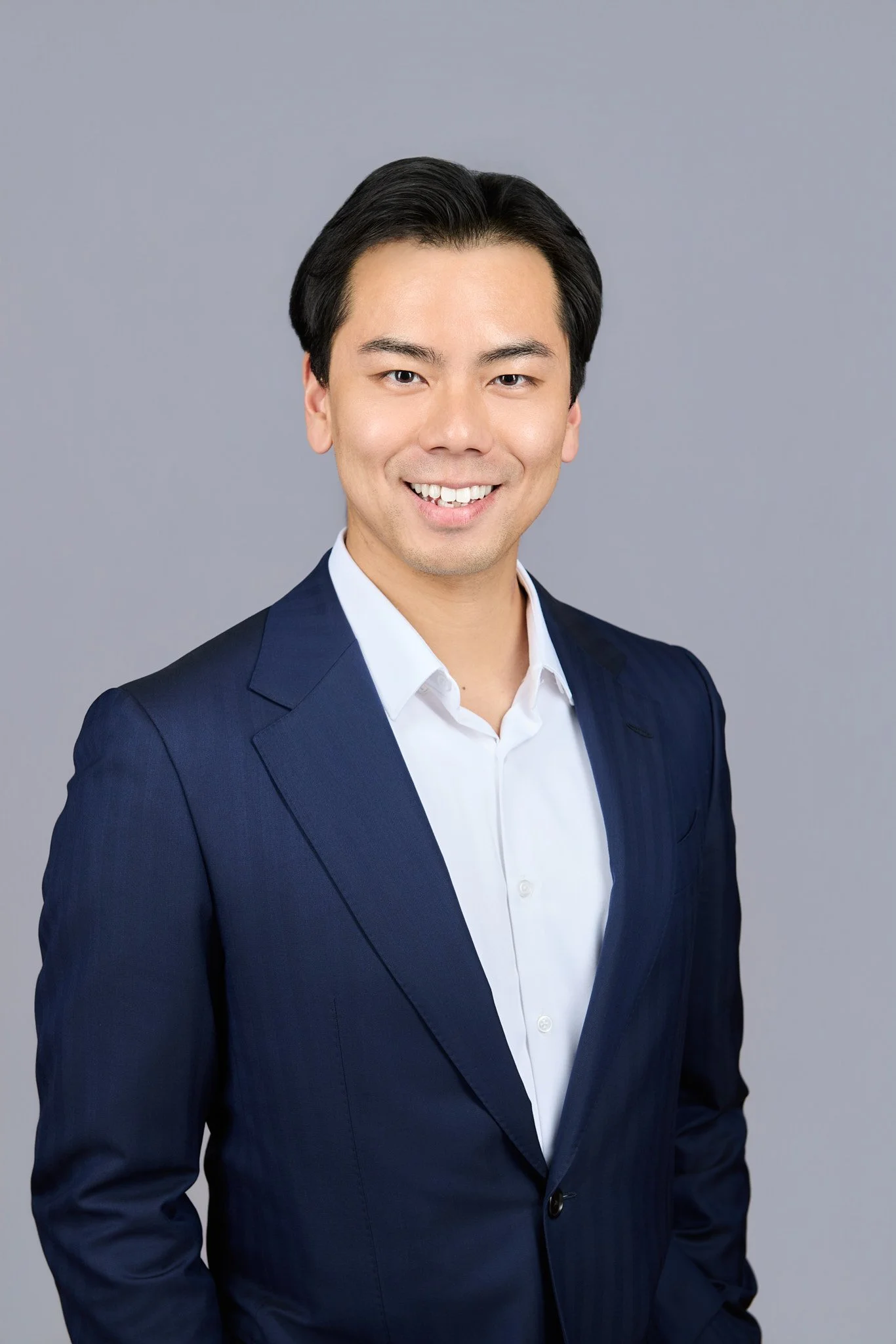 Vincent Li, against a gray background.