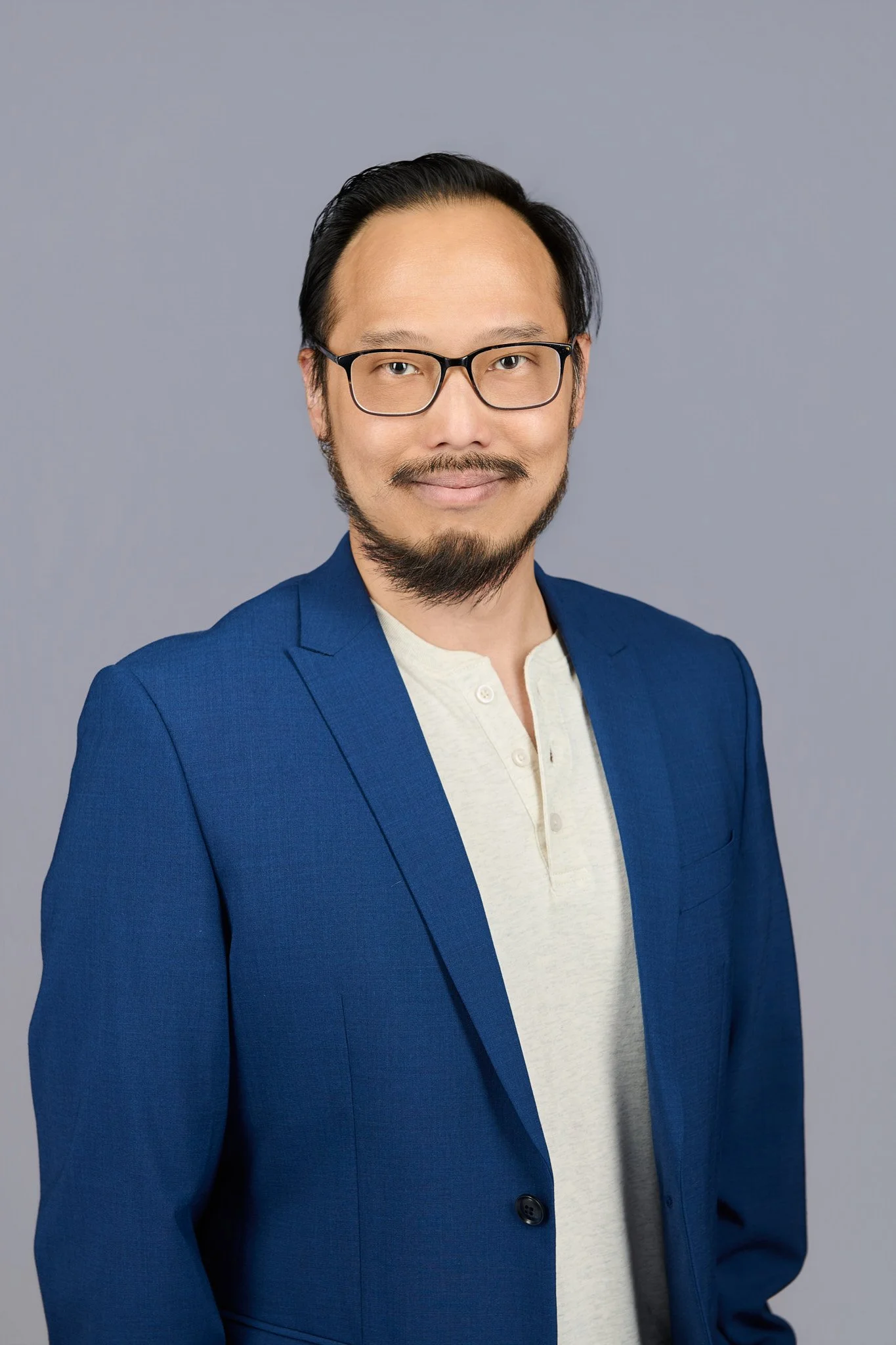 Alton Cheung against a gray background.