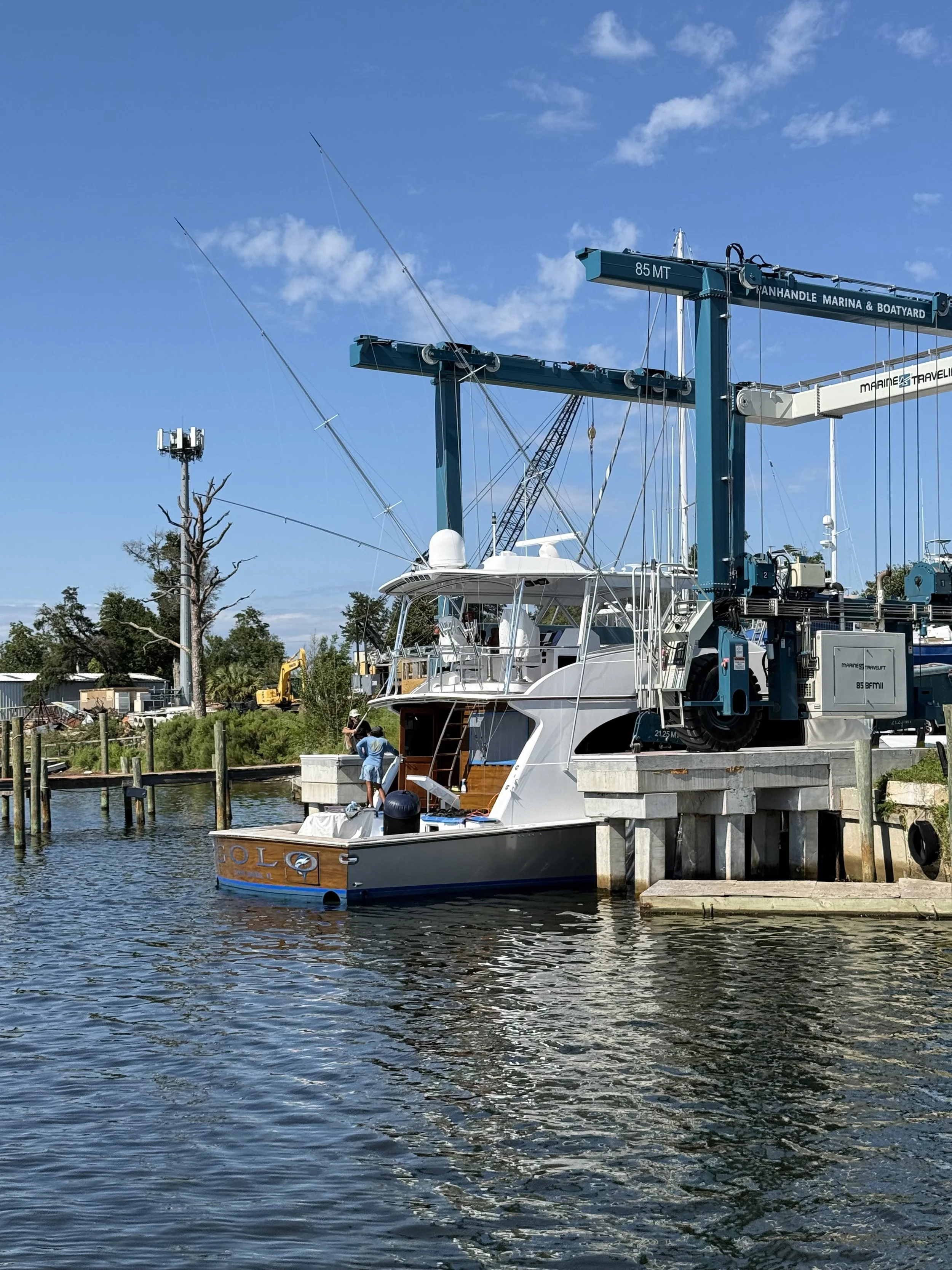 A image of the back of the boat as it is in the water after using a marine lift to launch it.