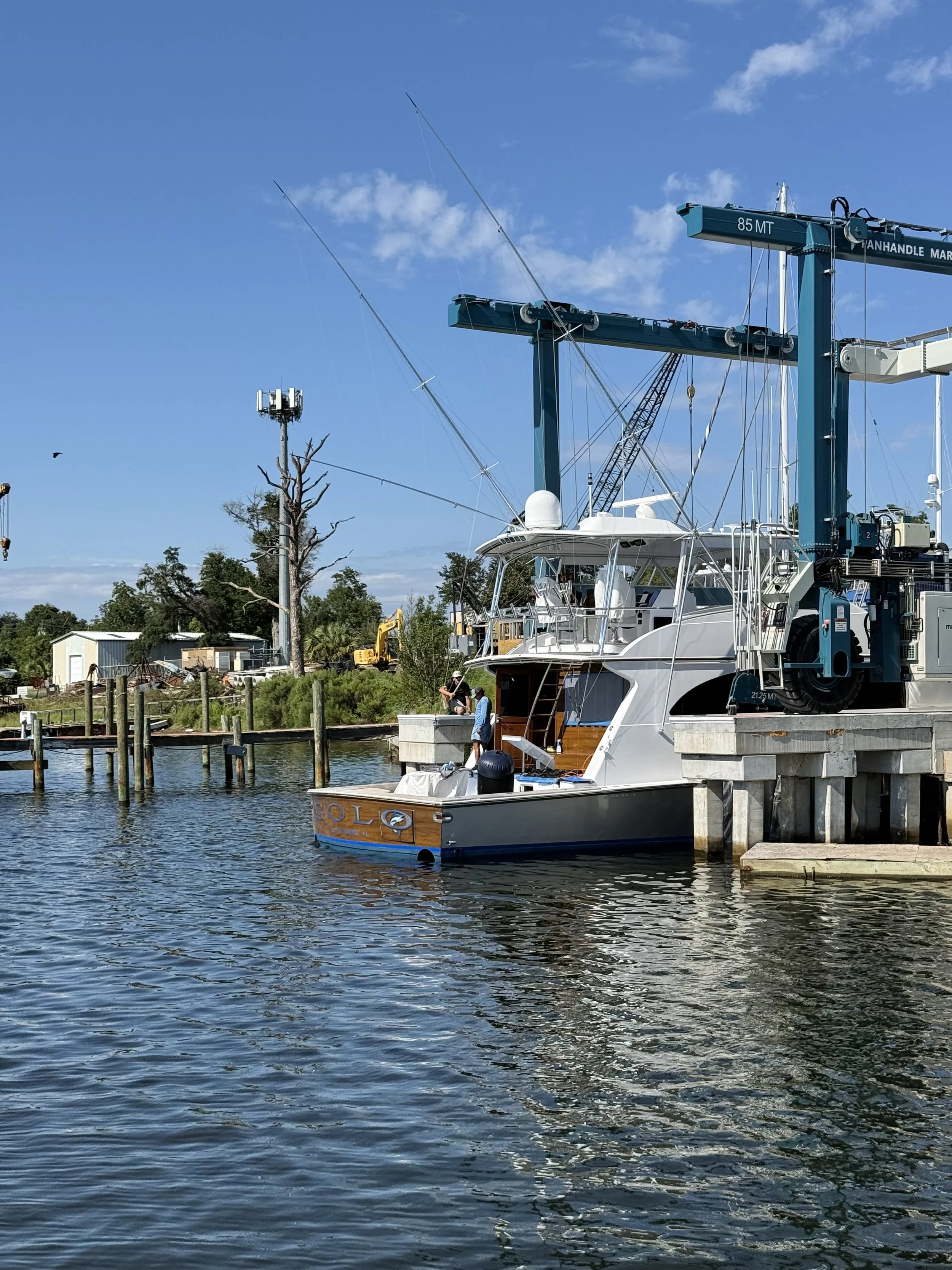 A image of the back of the boat as it is in the water after using a marine lift to launch it