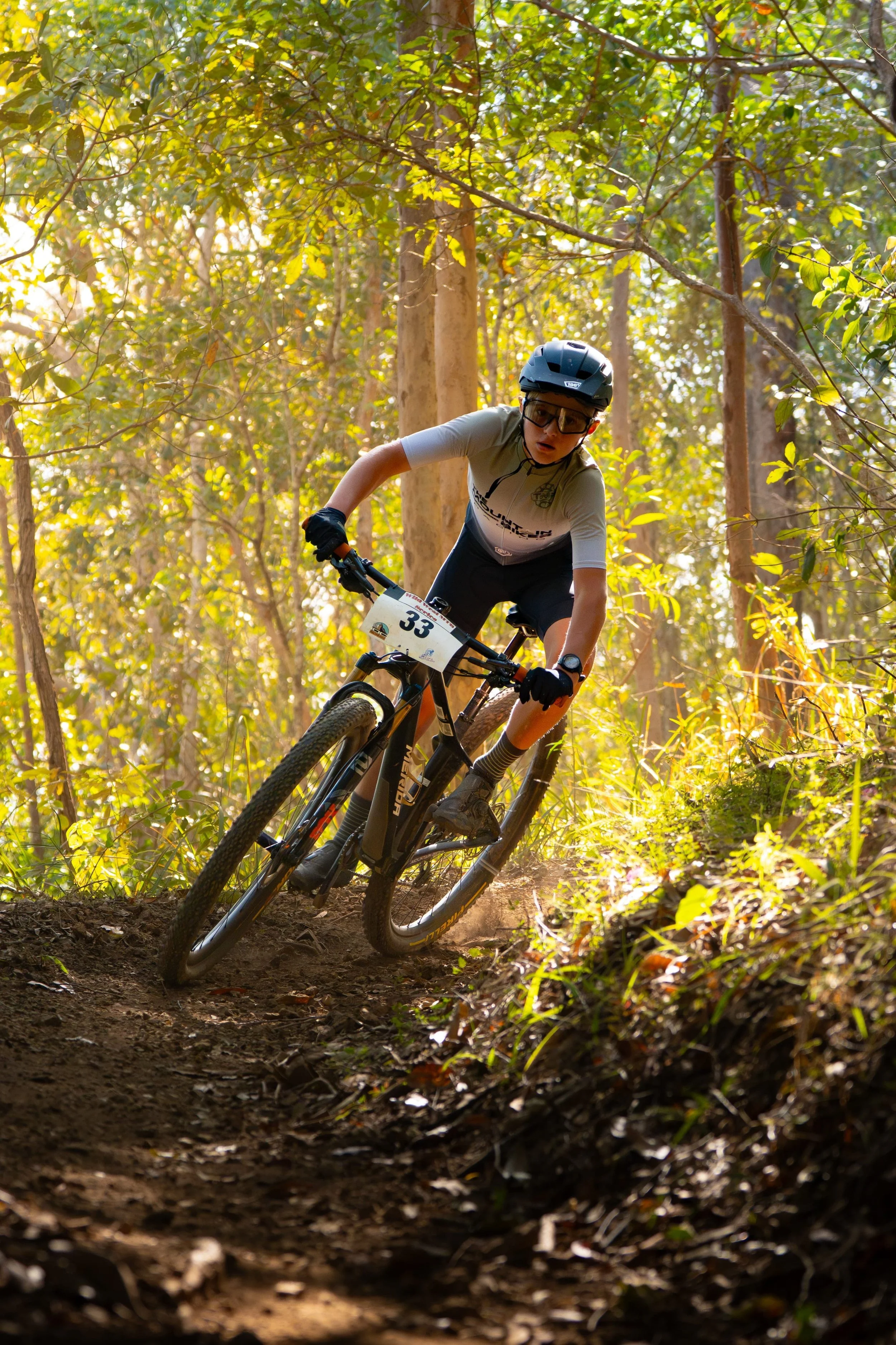 Mountain biker rounding a corner on a trail during the Wild West XCO Series at Mount Crosby