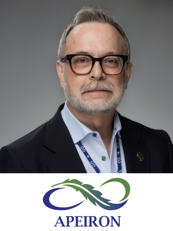 A man with gray hair, glasses, and a beard wearing a dark blazer and a light blue shirt, standing in front of a gray background with the APEIRON logo below.