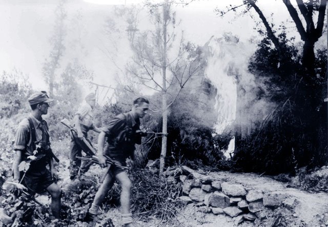Mountain troops setting fire to homes, summer 1943.