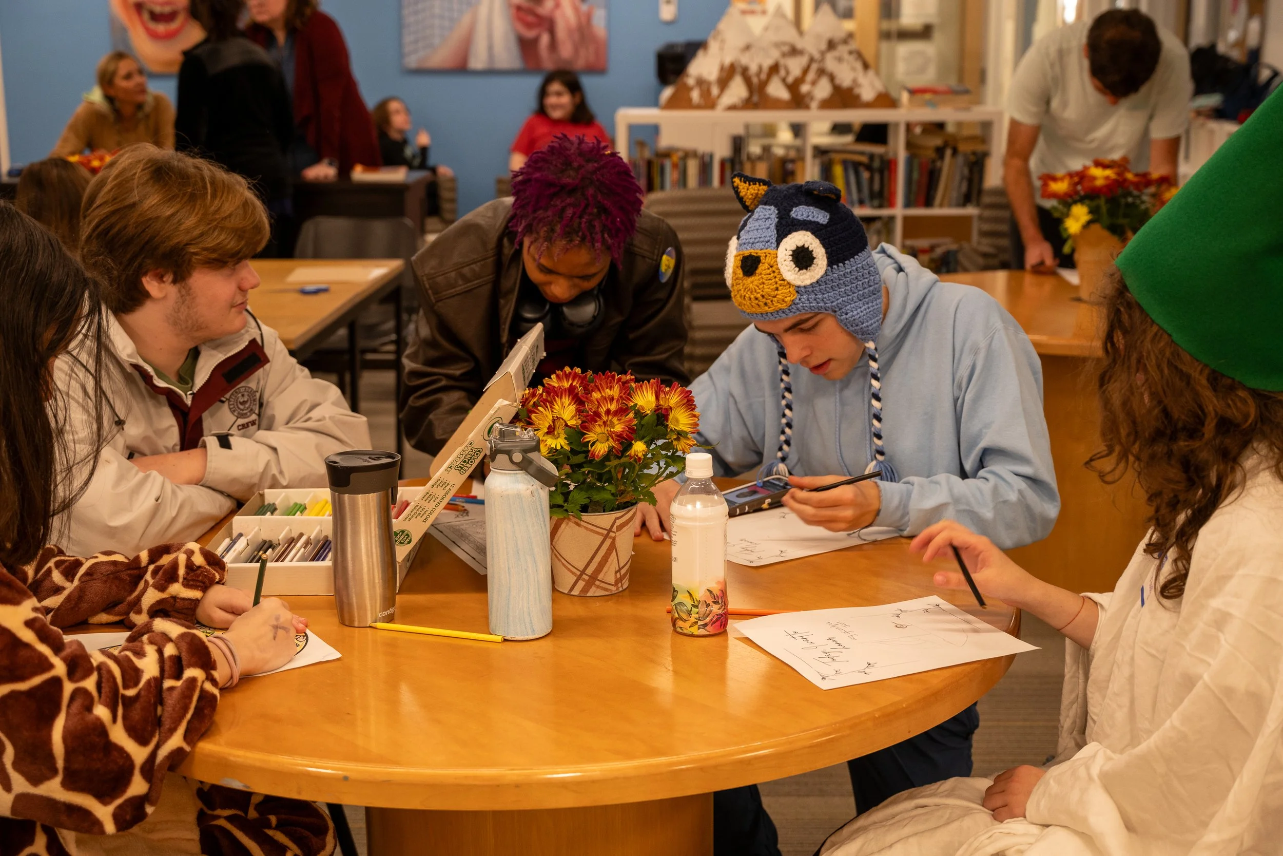 Students working a learning together at a round table