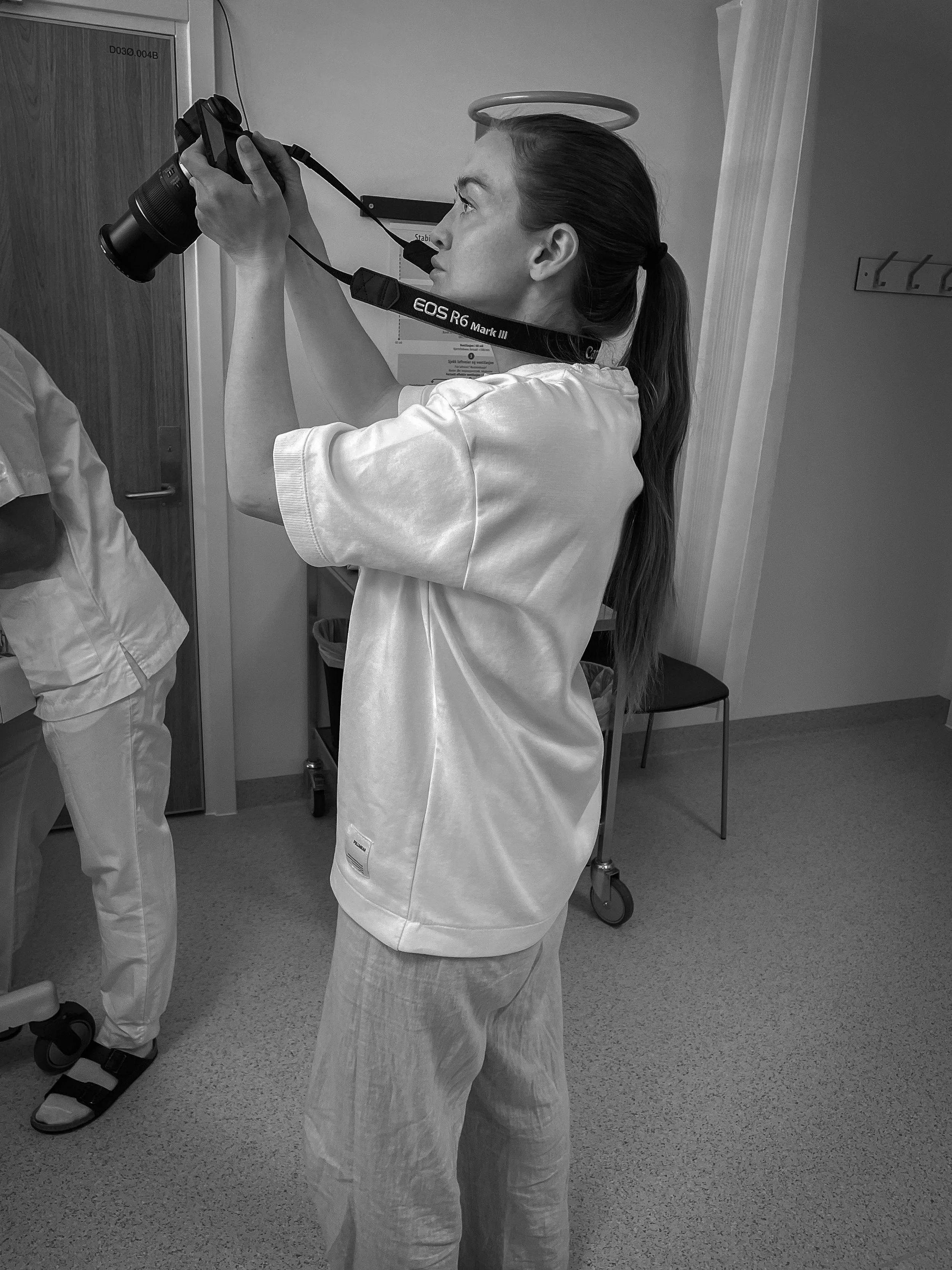 Photo of Ellie taking a photo during birth