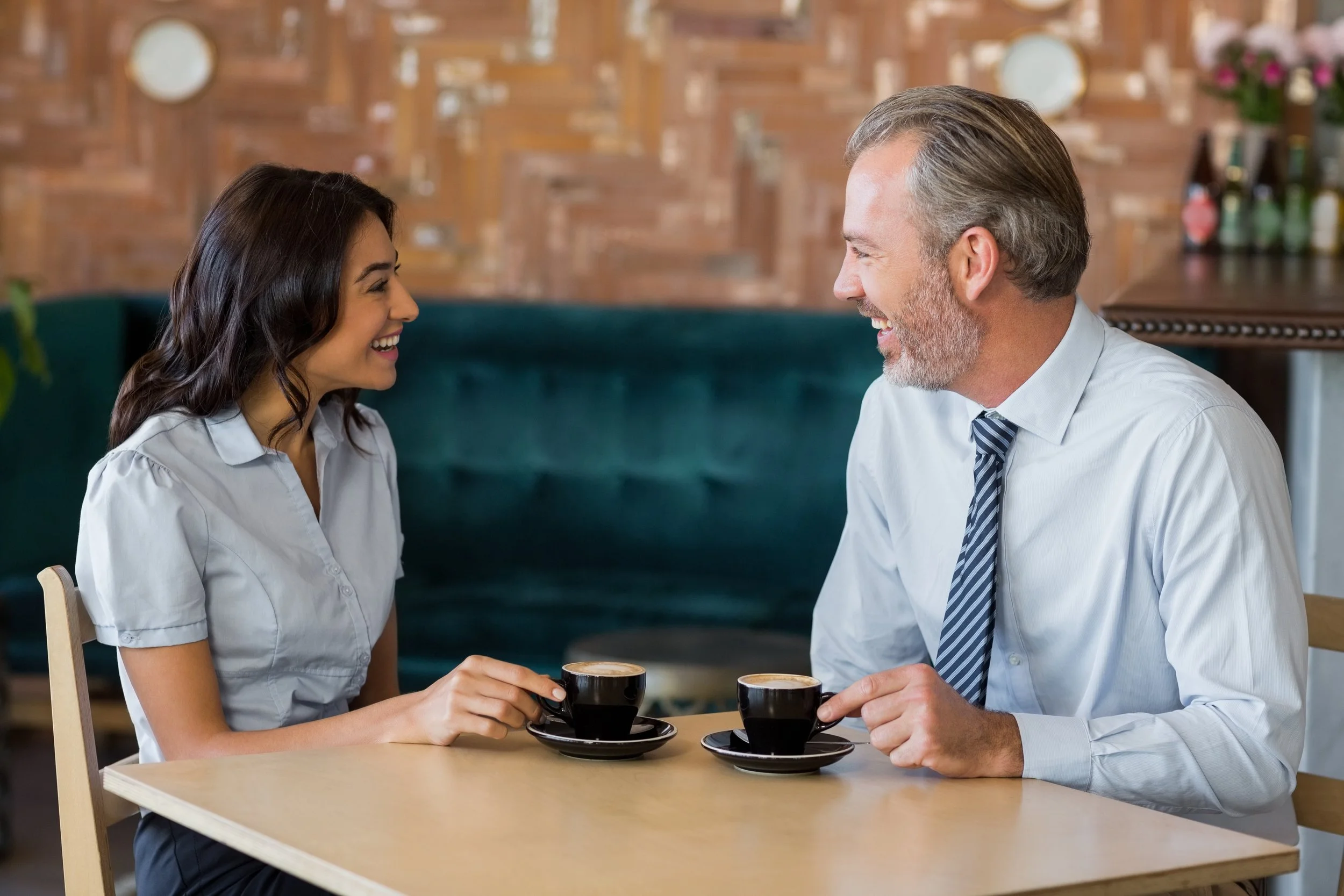 Man and woman meeting over coffee in restaurant