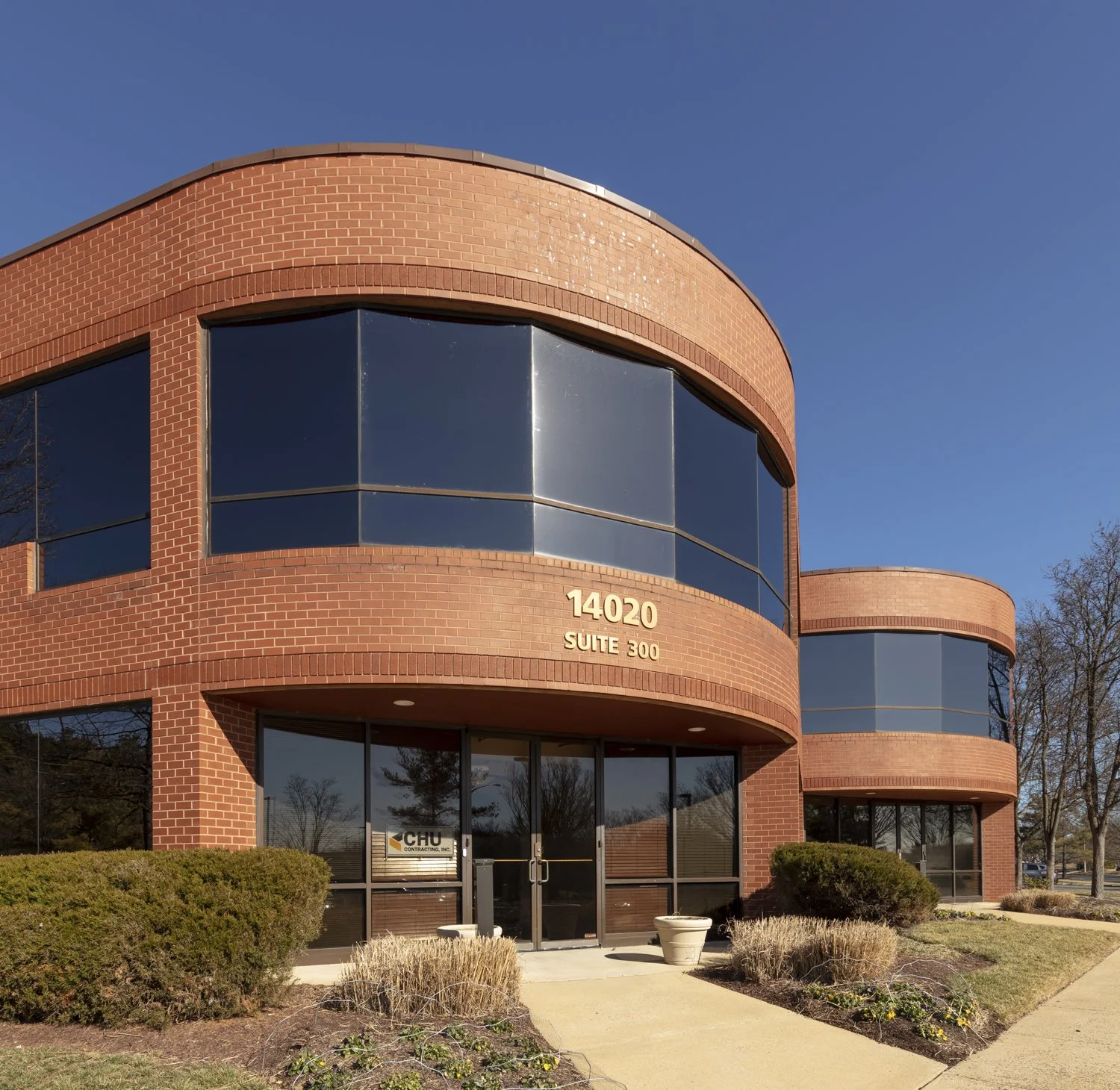 Thunderbolt Flex Industrial property in Chantilly, Virginia, featuring a two-story brick exterior with large windows and landscaped grounds.