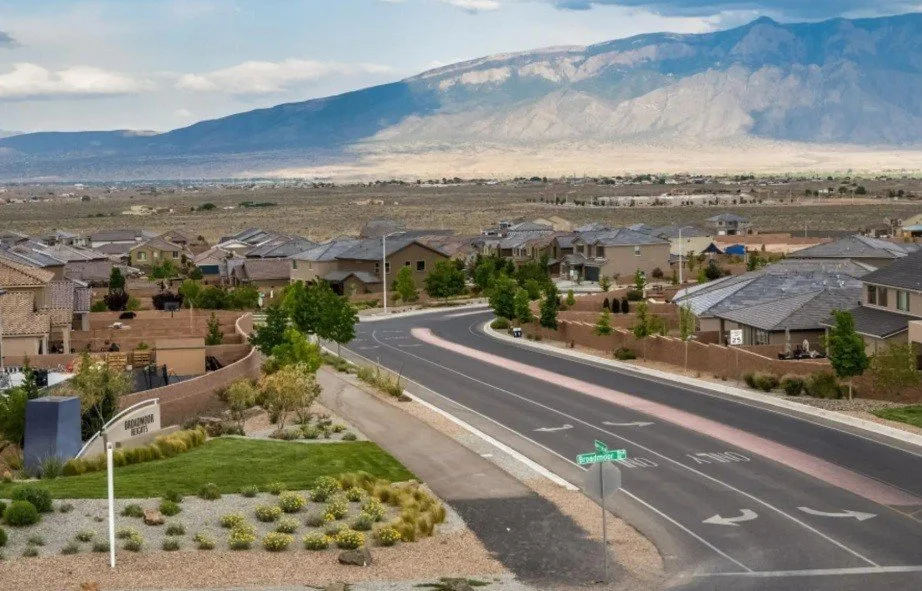Broadmoor Heights residential community in Rio Rancho, New Mexico, featuring neighborhood homes and streets with the Sandia Mountains in the background.