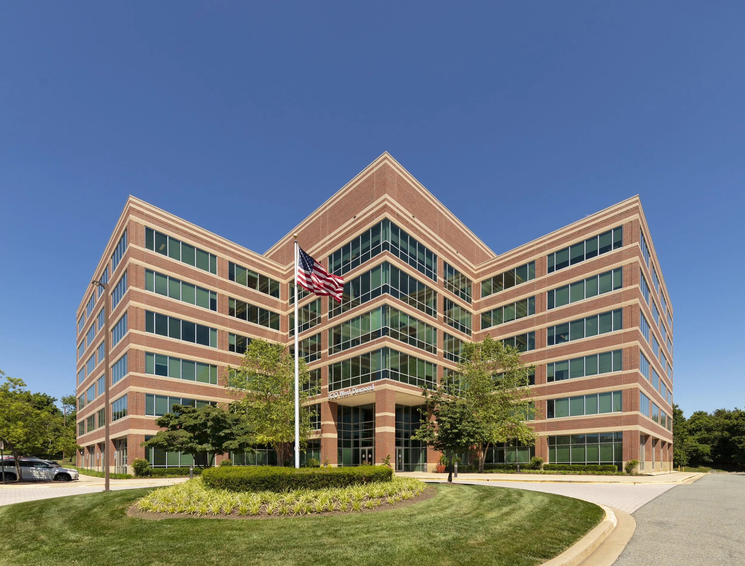 Exterior view of West Diamond Medical Office in Gaithersburg, Maryland, featuring the multi-story brick medical office building and landscaped grounds.
