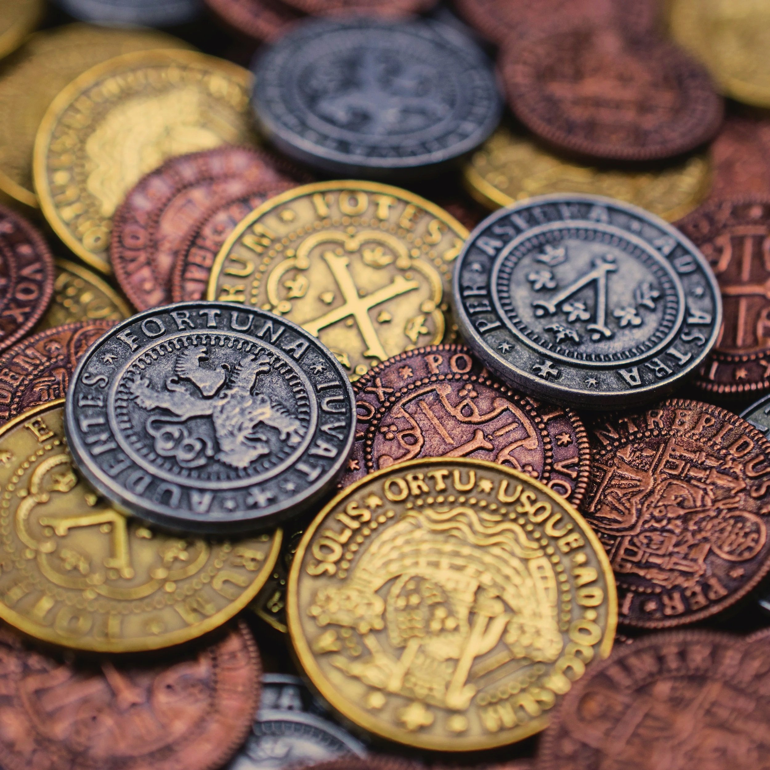 Close-up of various U.S. coins, including pennies, nickels, and dimes, showing different designs and denominations.