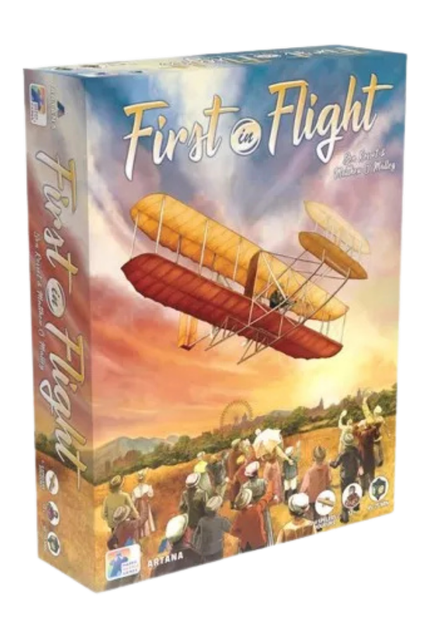 Board game box titled "First in Flight" with an illustration of a vintage biplane flying over an outdoor gathering of people at sunset.