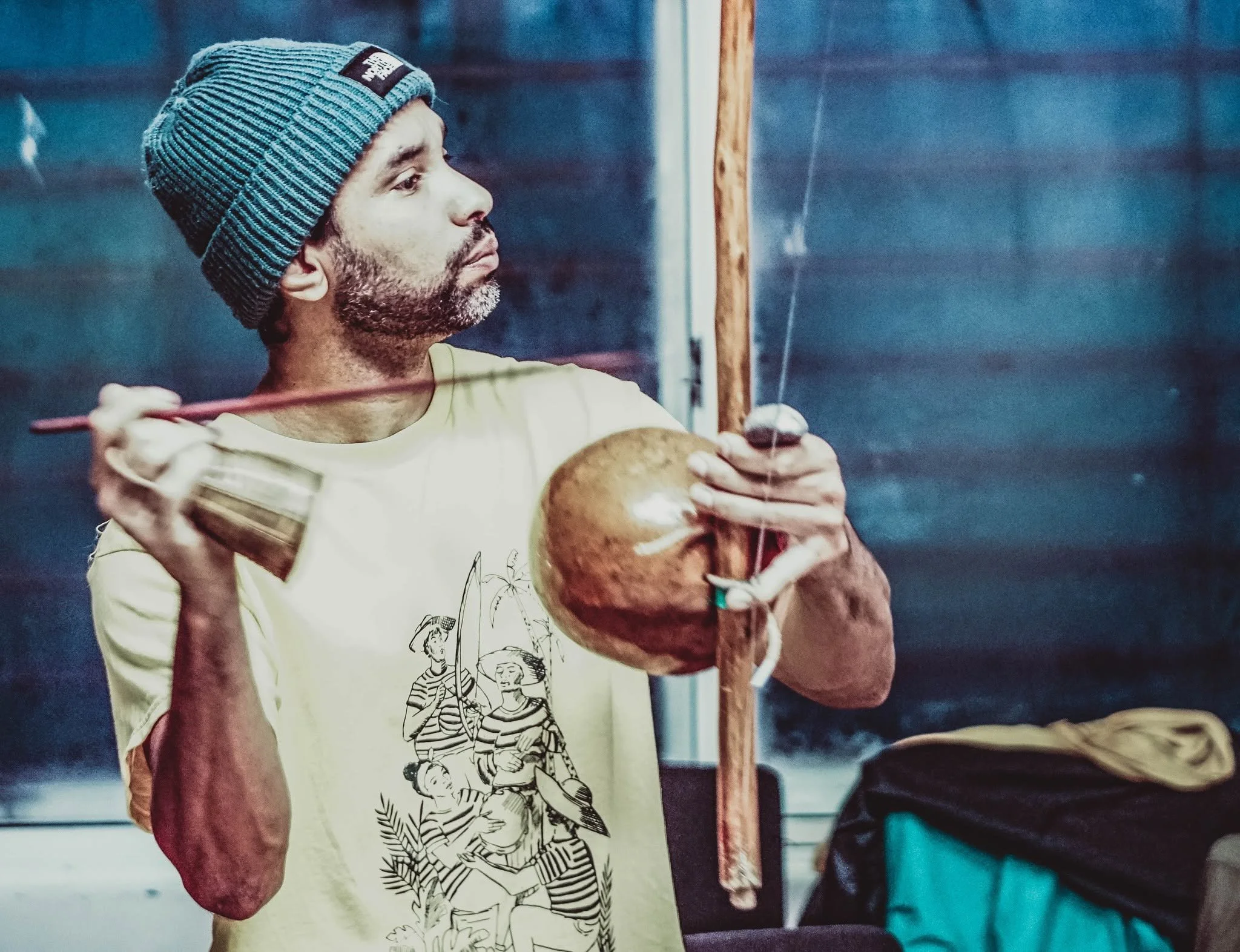 Contramestre Igor playing the berimbau