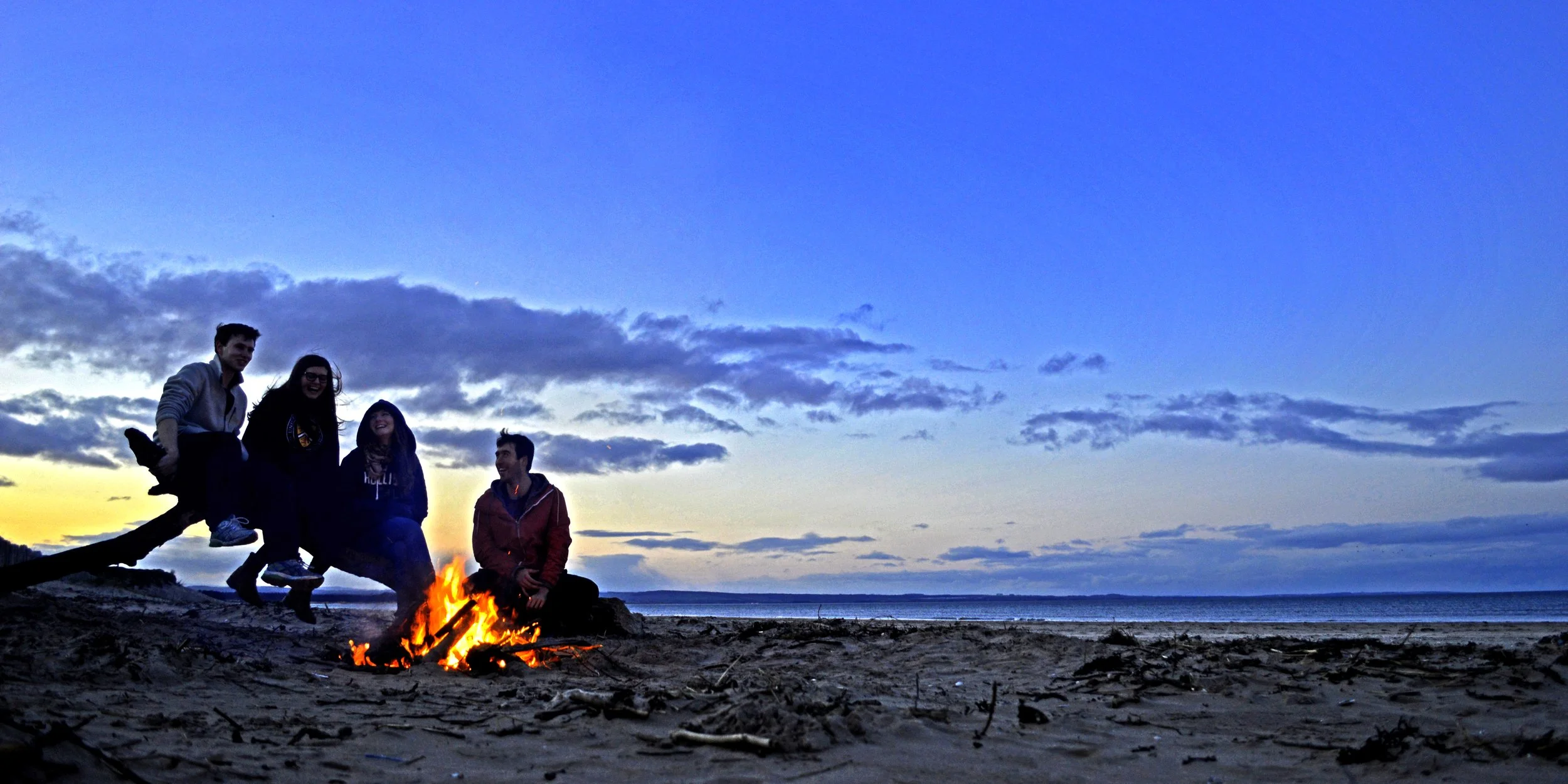 The paper was used as the kindling to make a new beach fire (fire).