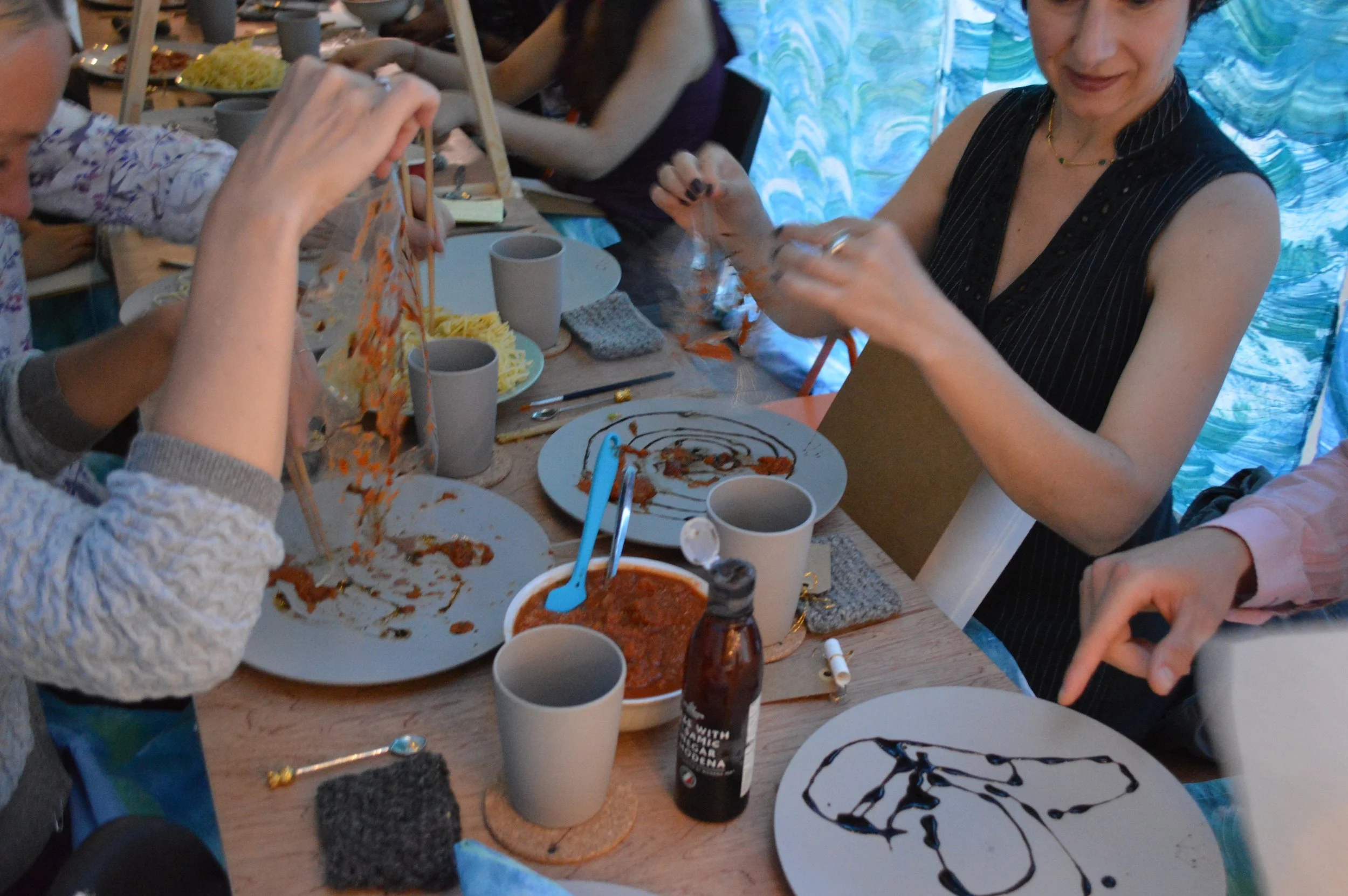 Balsamic glaze monoprint; tomato sauce screenprint; spaghetti lasercut; cheese gold leaf. 