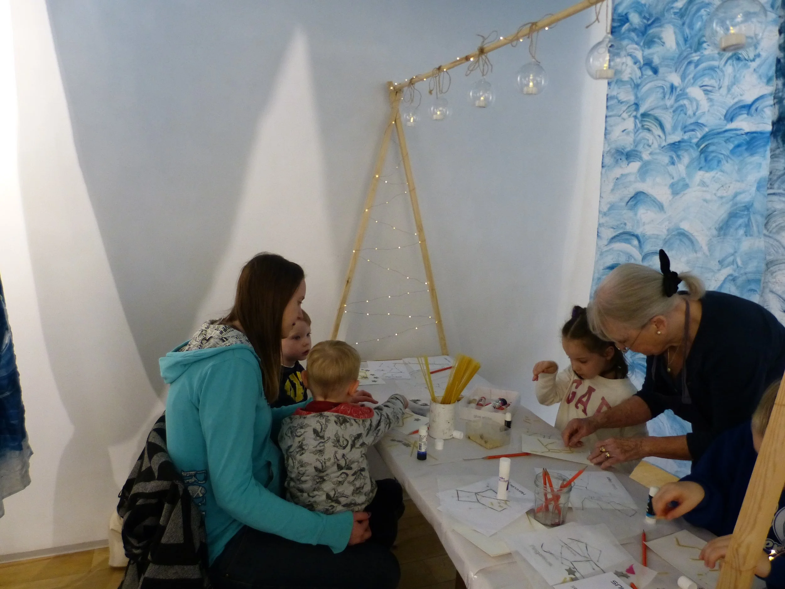 Both the adults and the children enjoyed making their embossments underneath the constellation canopy of the tent.