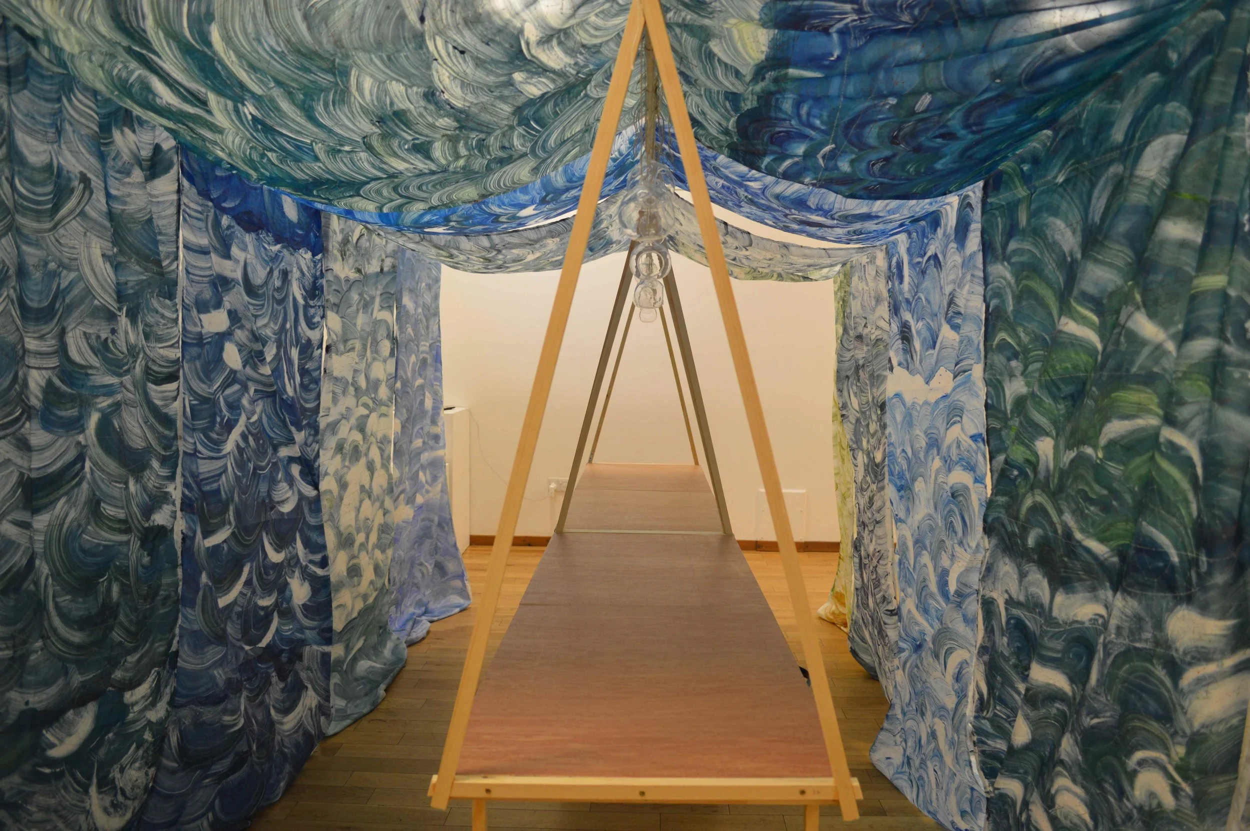 The tent was hung in the community workshop room. 