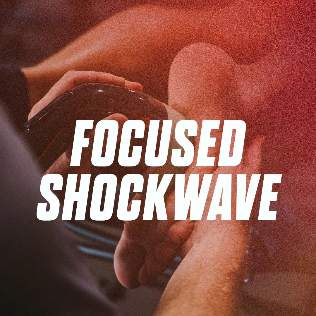 A person holding a black mug, focusing on their hand and arm, with the overlay text 'Focused Shockwave'.