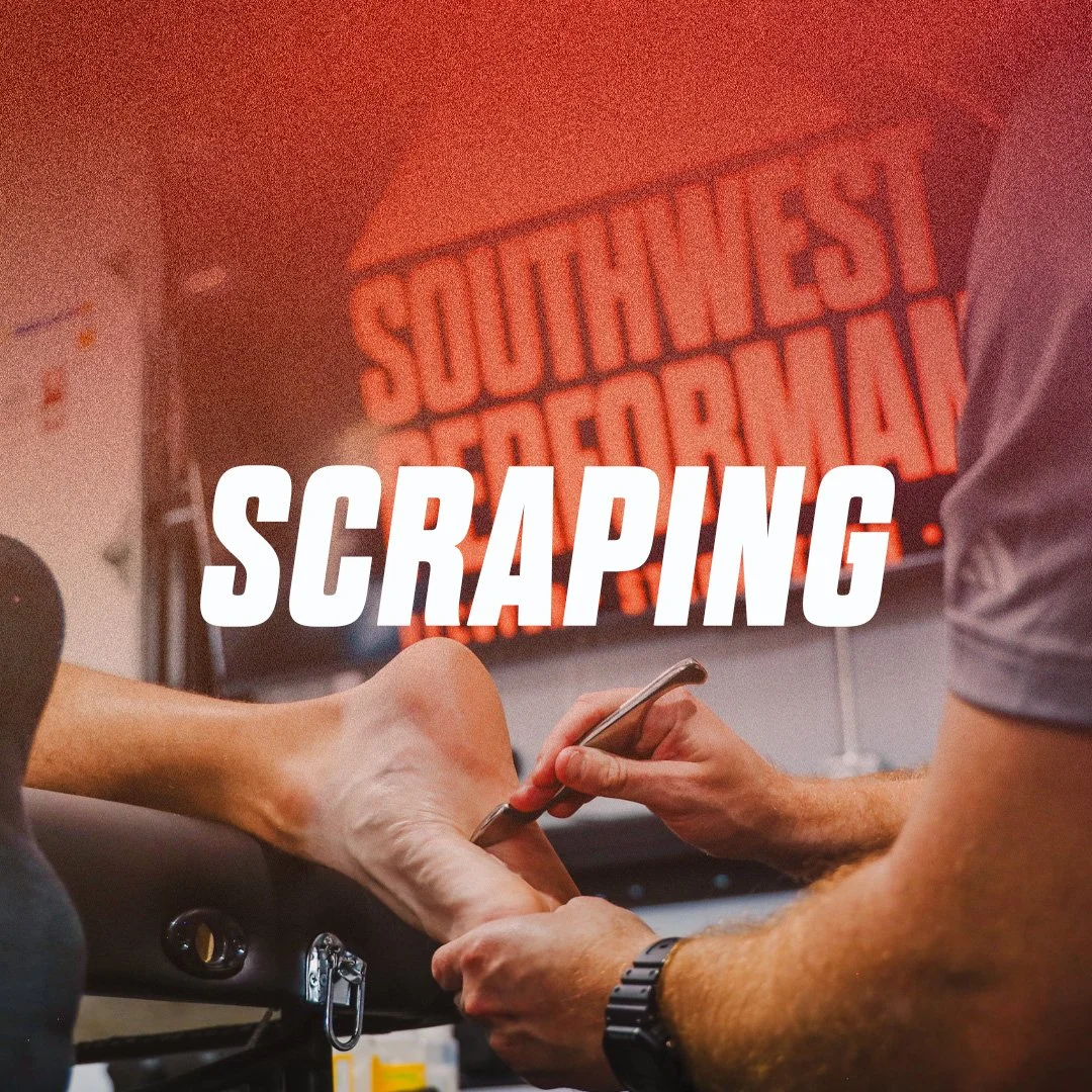 A person is getting a tattoo on their foot while another person is scraping or tattooing it. There is a bright sign in the background that reads 'SOUTHERN SCRAP'.