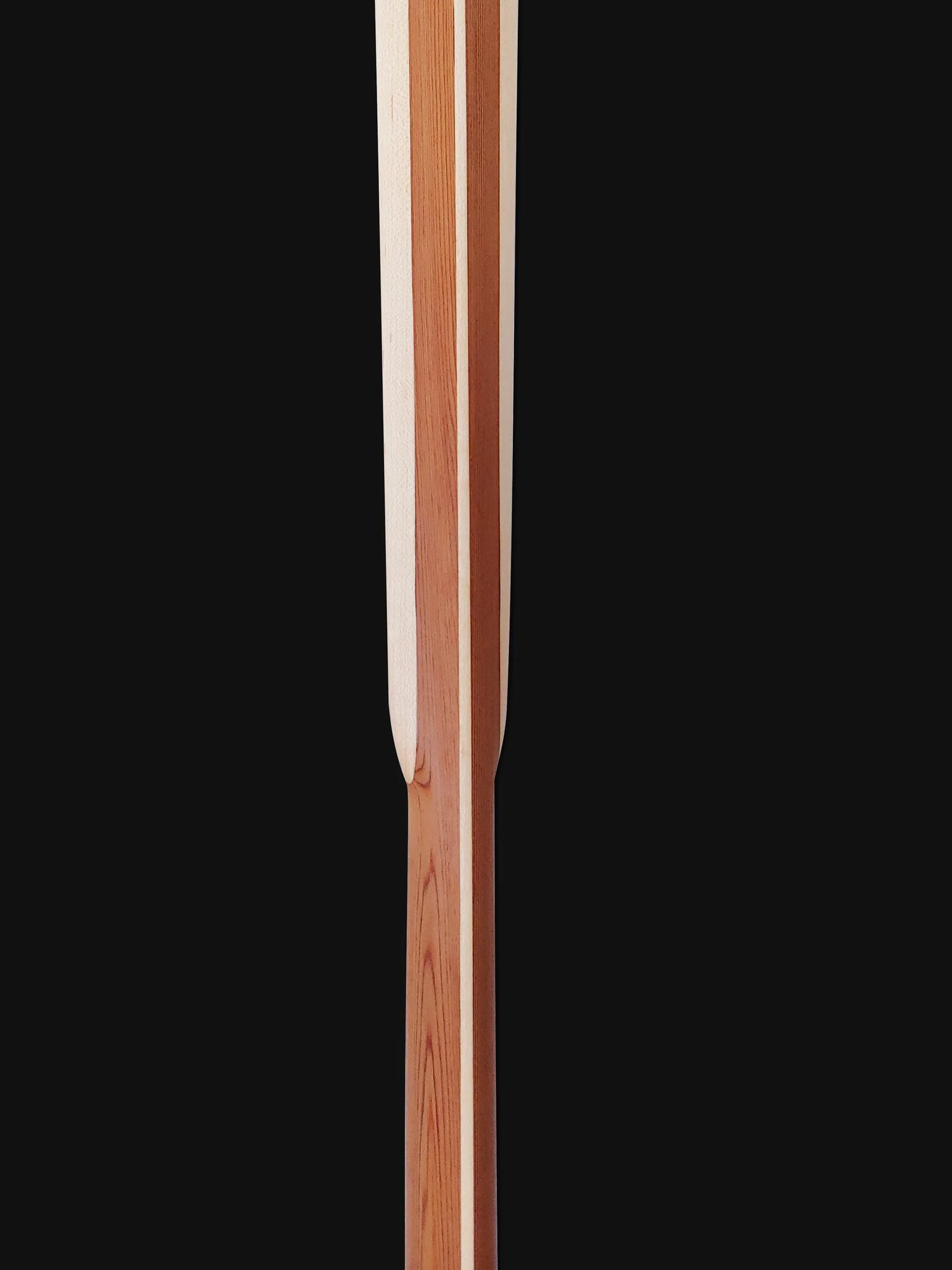 Close-up Traditional Greenland Kayak Paddle Shoulders and Loom. Made out of Western Red Cedar and laminated Maple hardwood center spine and blade edges.