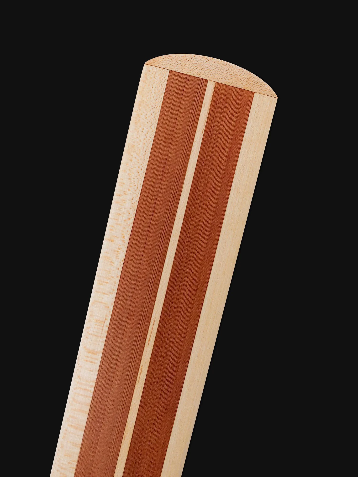 Close-up Traditional Greenland Kayak Paddle made out of Western Red Cedar and laminated Maple hardwood center spine and blade edges.