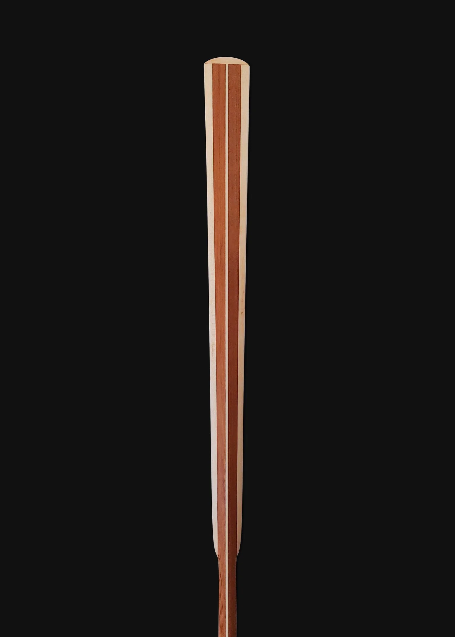 Traditional Greenland Kayak Paddle made out of Western Red Cedar and laminated Maple hardwood center spine and blade edges.