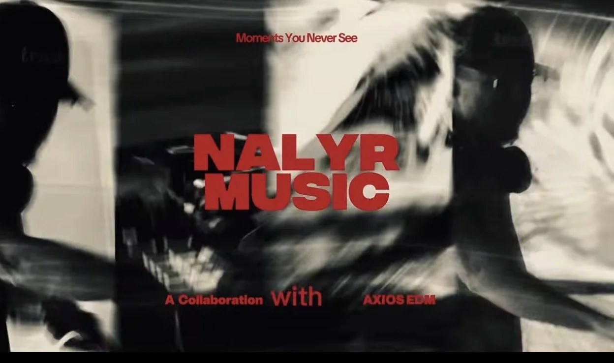 Black and white image with silhouettes of two people, and bold red text that reads "NAL YR MUSIC" with smaller red text above and below it.