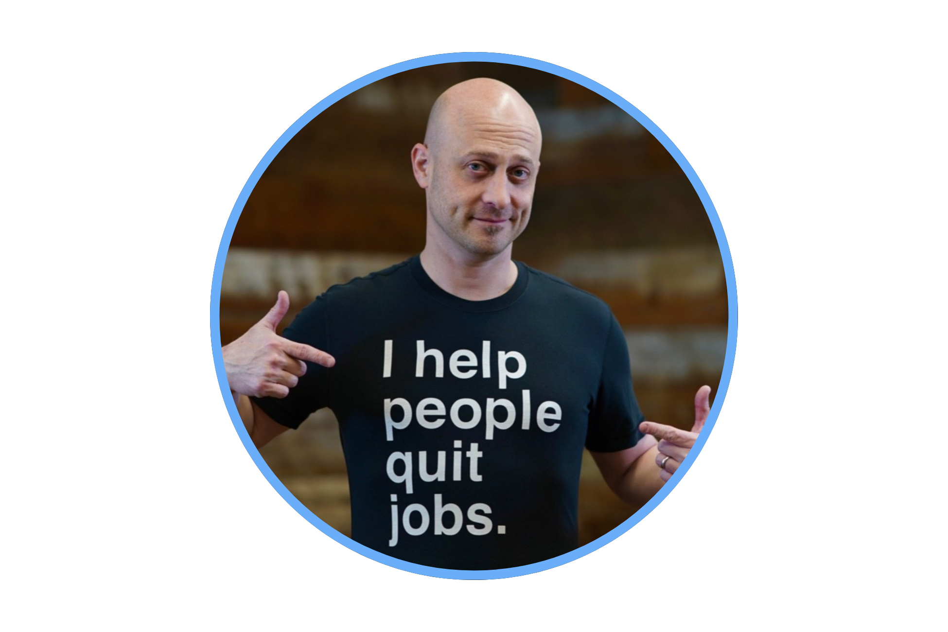 Man wearing a black t-shirt that says 'I help people quit jobs,' pointing at himself with both hands, standing indoors.