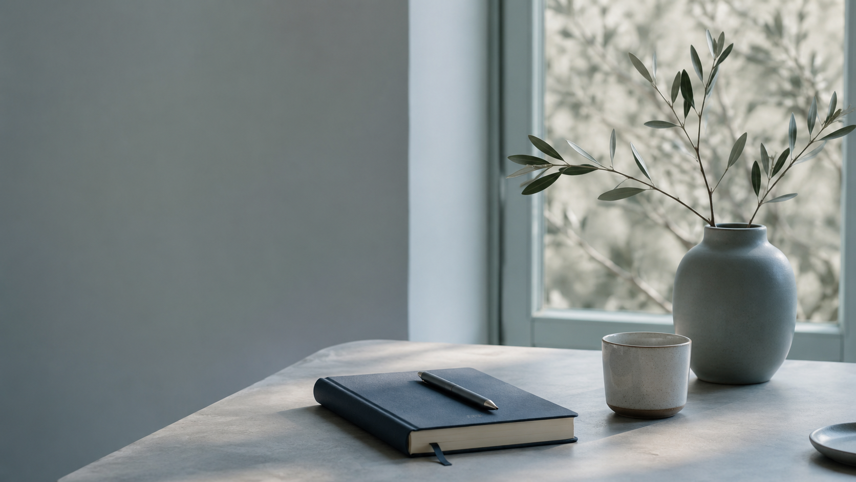 Notebook and pen in a calm space for reflection