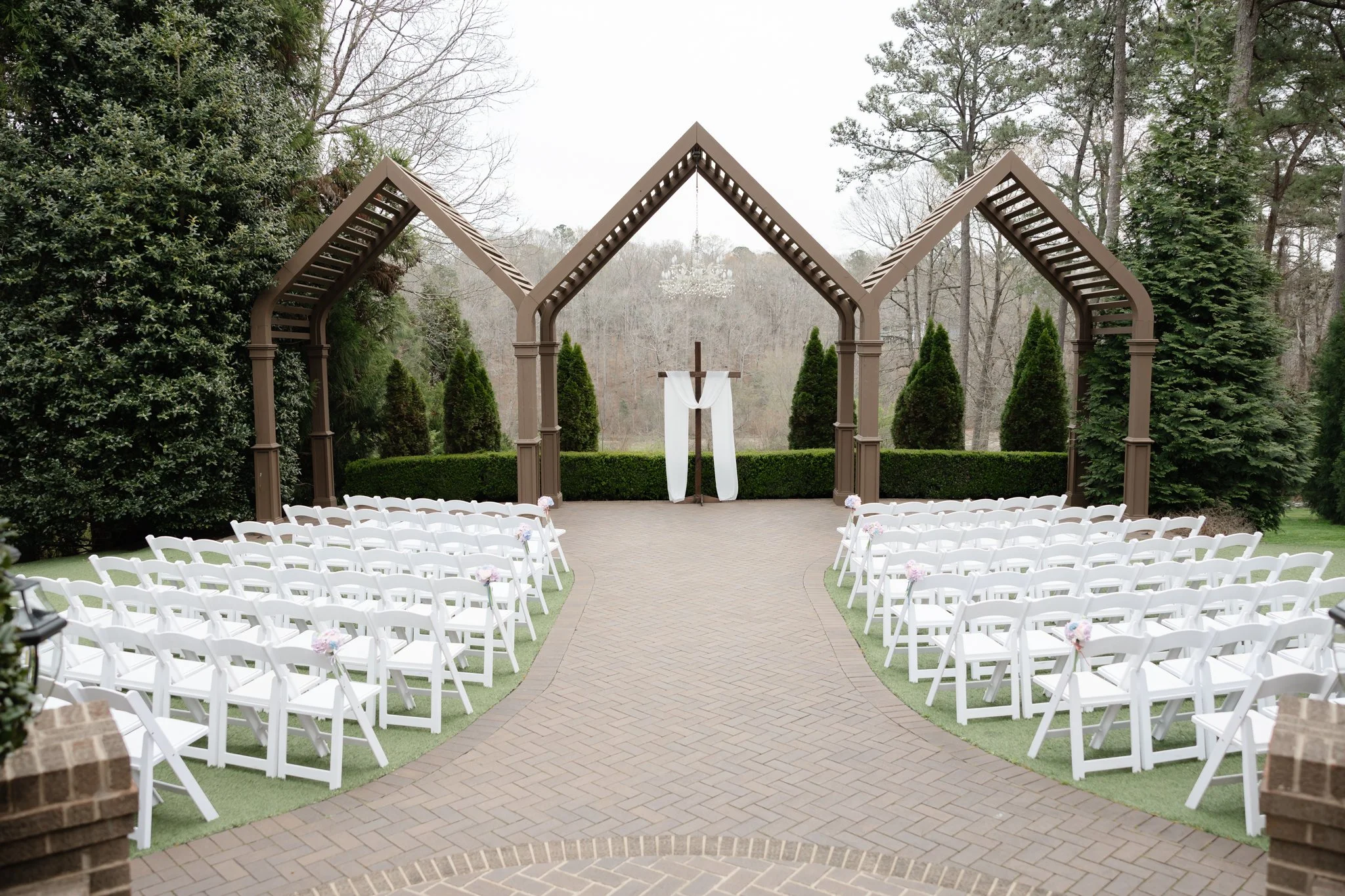 Elegant Highgrove Estate wedding ceremony surrounded by lush greenery and timeless architecture