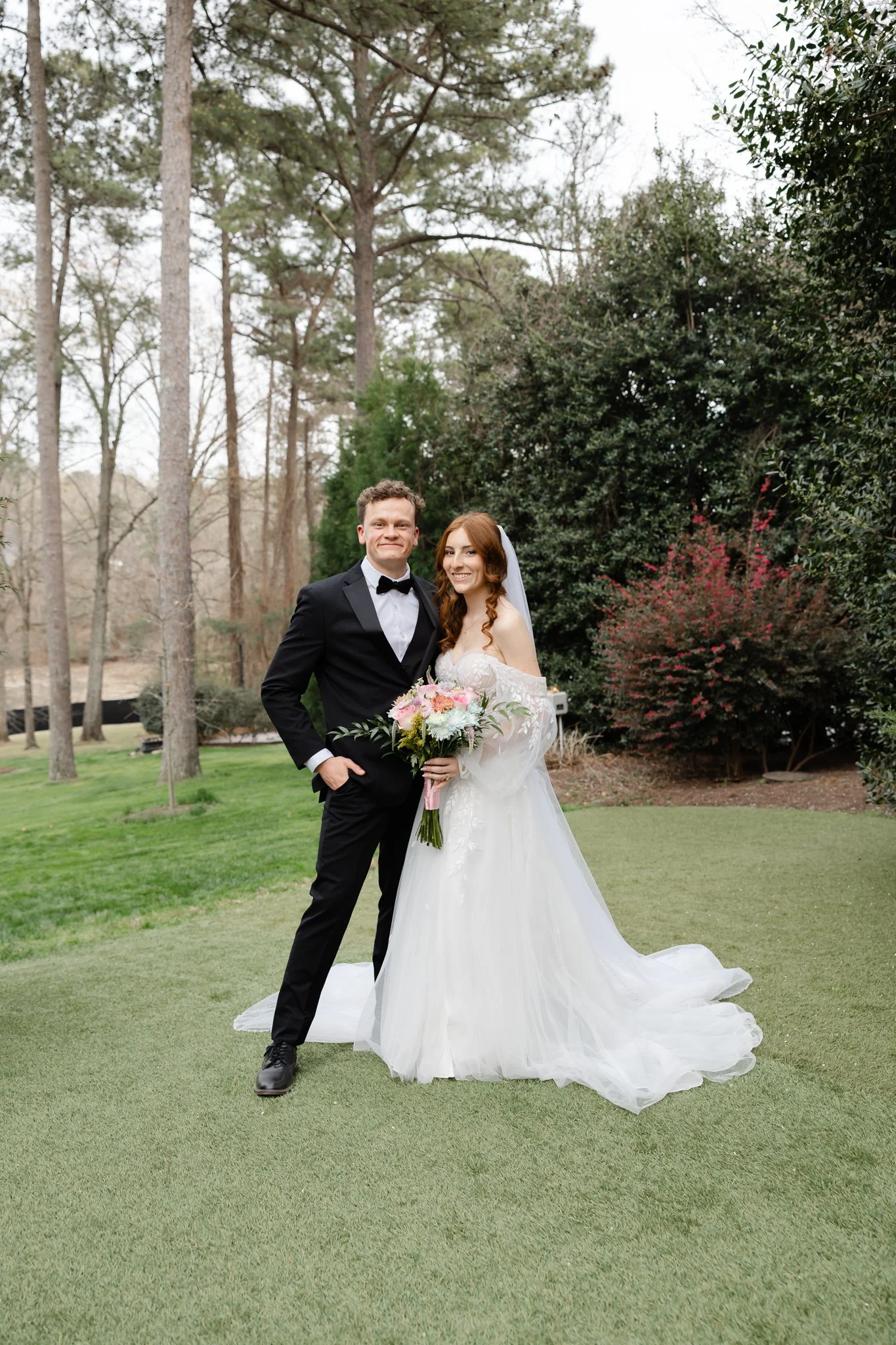 Bride and groom sharing a romantic portrait in the gardens at Highgrove Estate in North Carolina