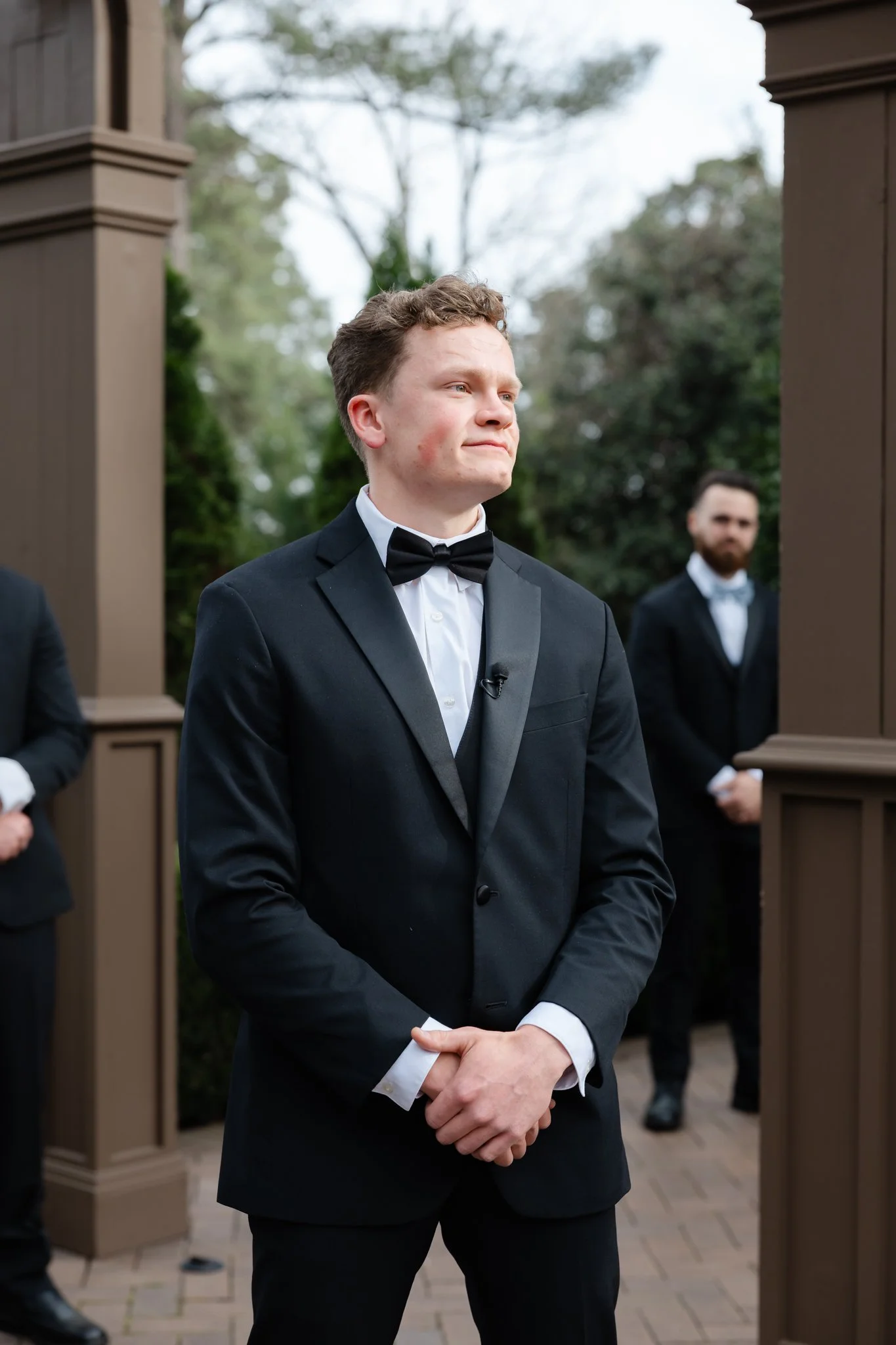 Groom watching his bride during their emotional wedding ceremony at Highgrove Estate