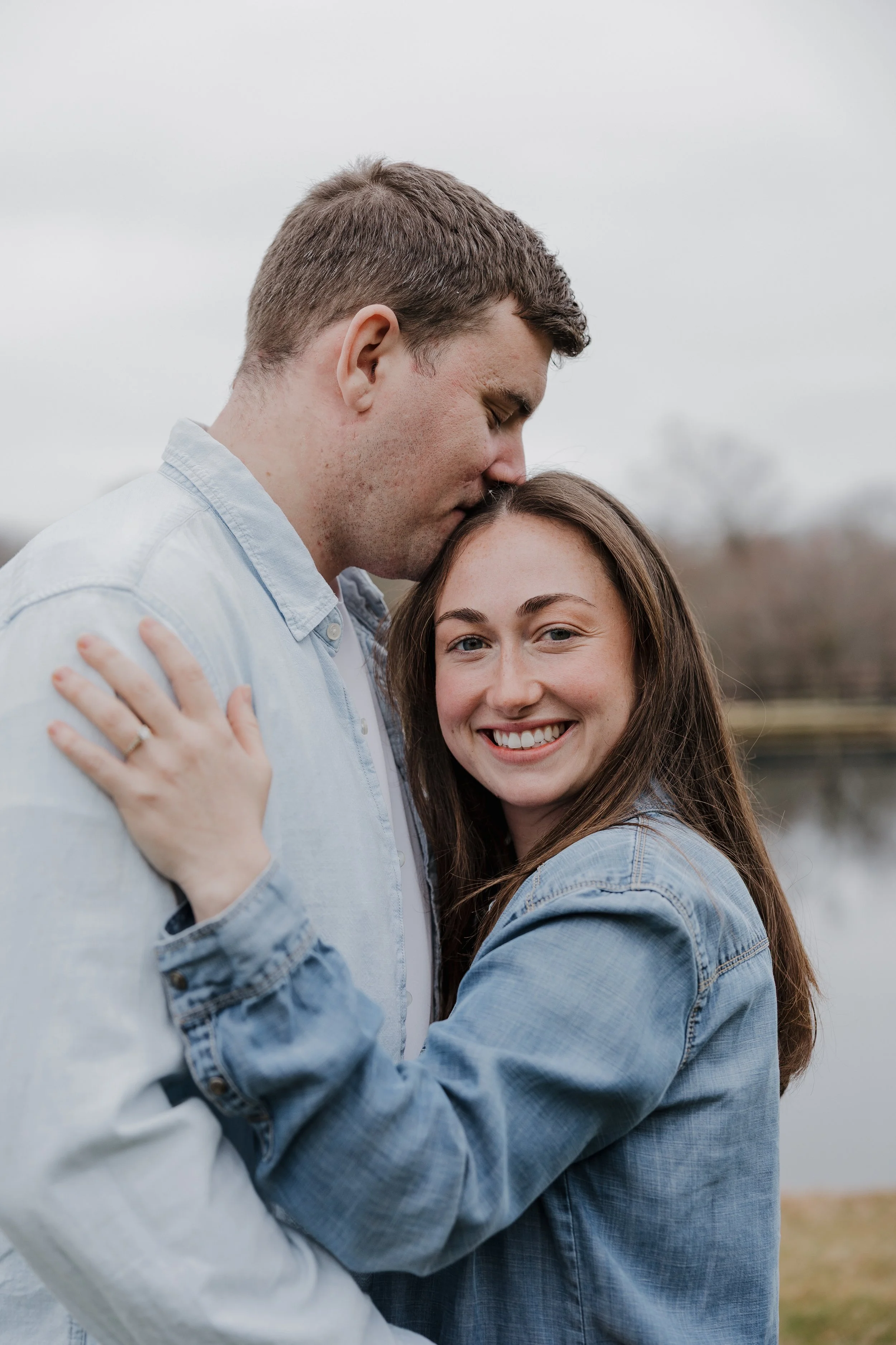 Danielle and Greg embracing during their engagement session at Morning Glory Farm in Charlotte, North Carolina