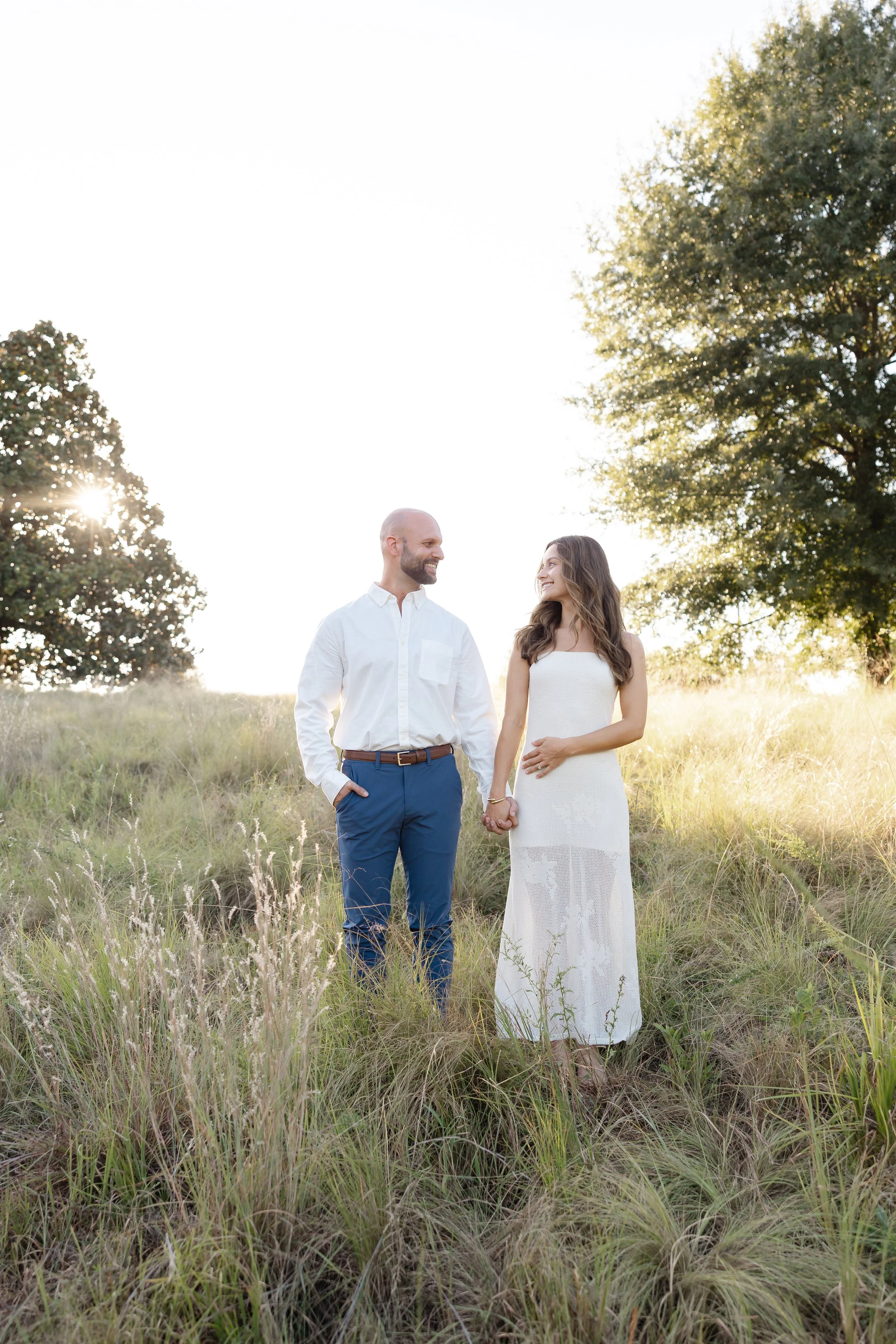 Natural and candid engagement photography at the North Carolina Museum of Art Park in Raleigh