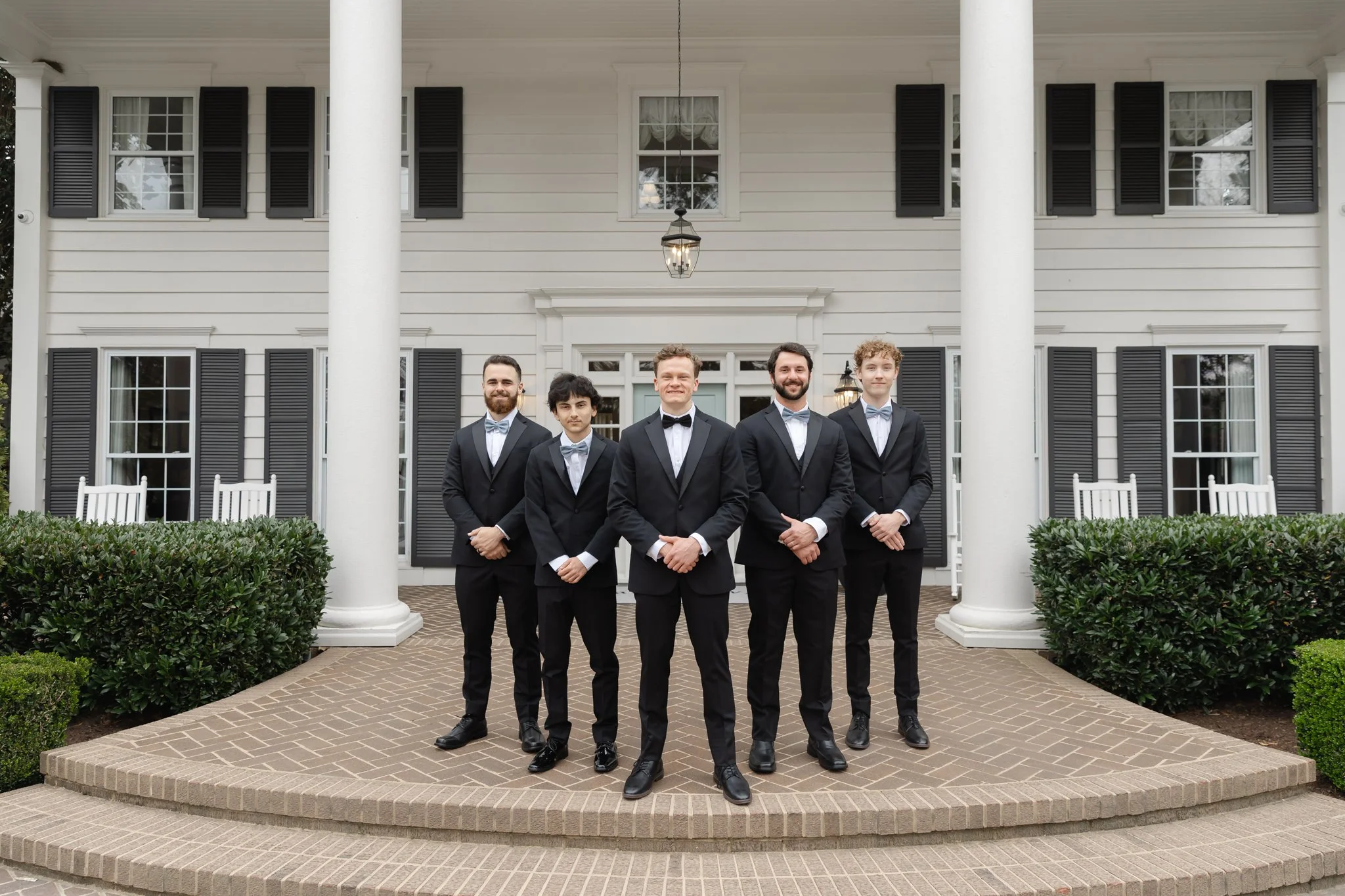 Timeless wedding portraits in front of Highgrove Estate's historic manor house