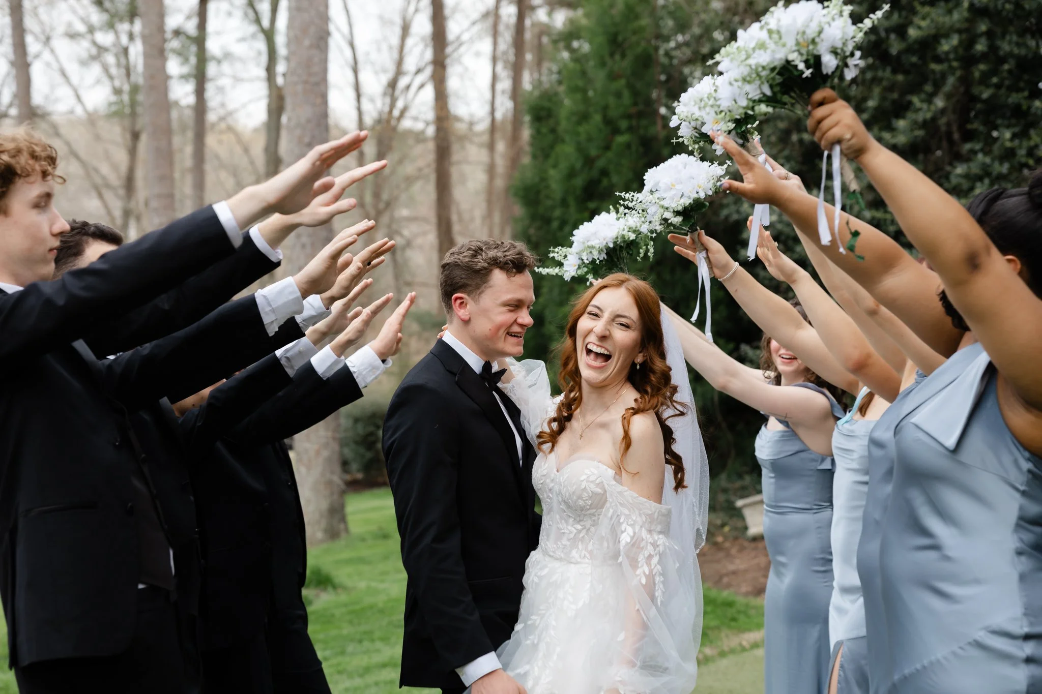 Candid wedding photography capturing joyful moments between the bride and groom at Highgrove Estate