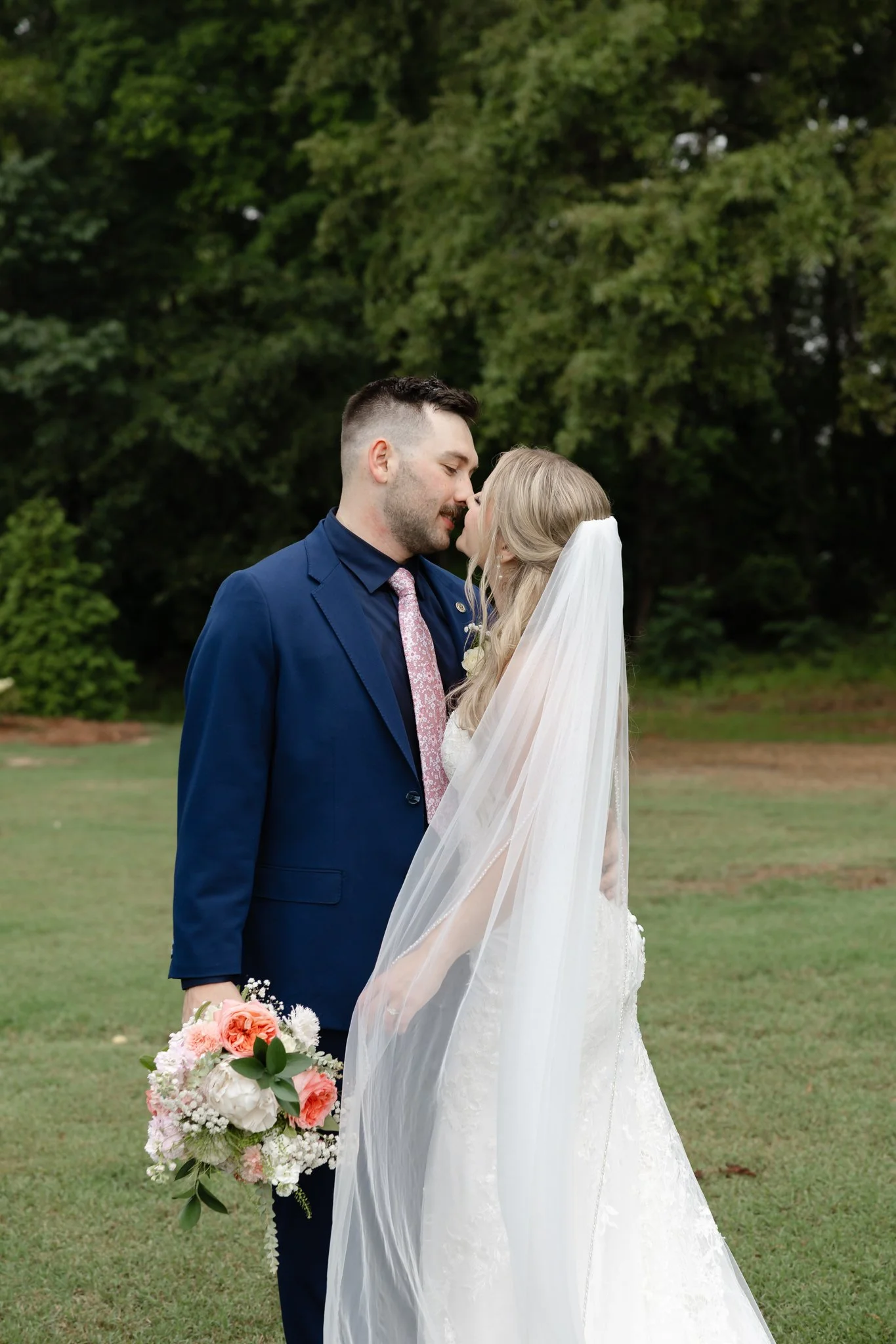 Bride and groom embracing after their intimate wedding ceremony at The Hartwood in North Carolina