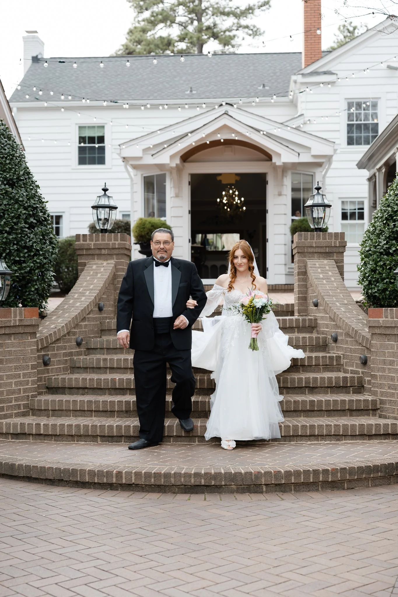 Bride walking down the aisle during a romantic Highgrove Estate wedding ceremony.