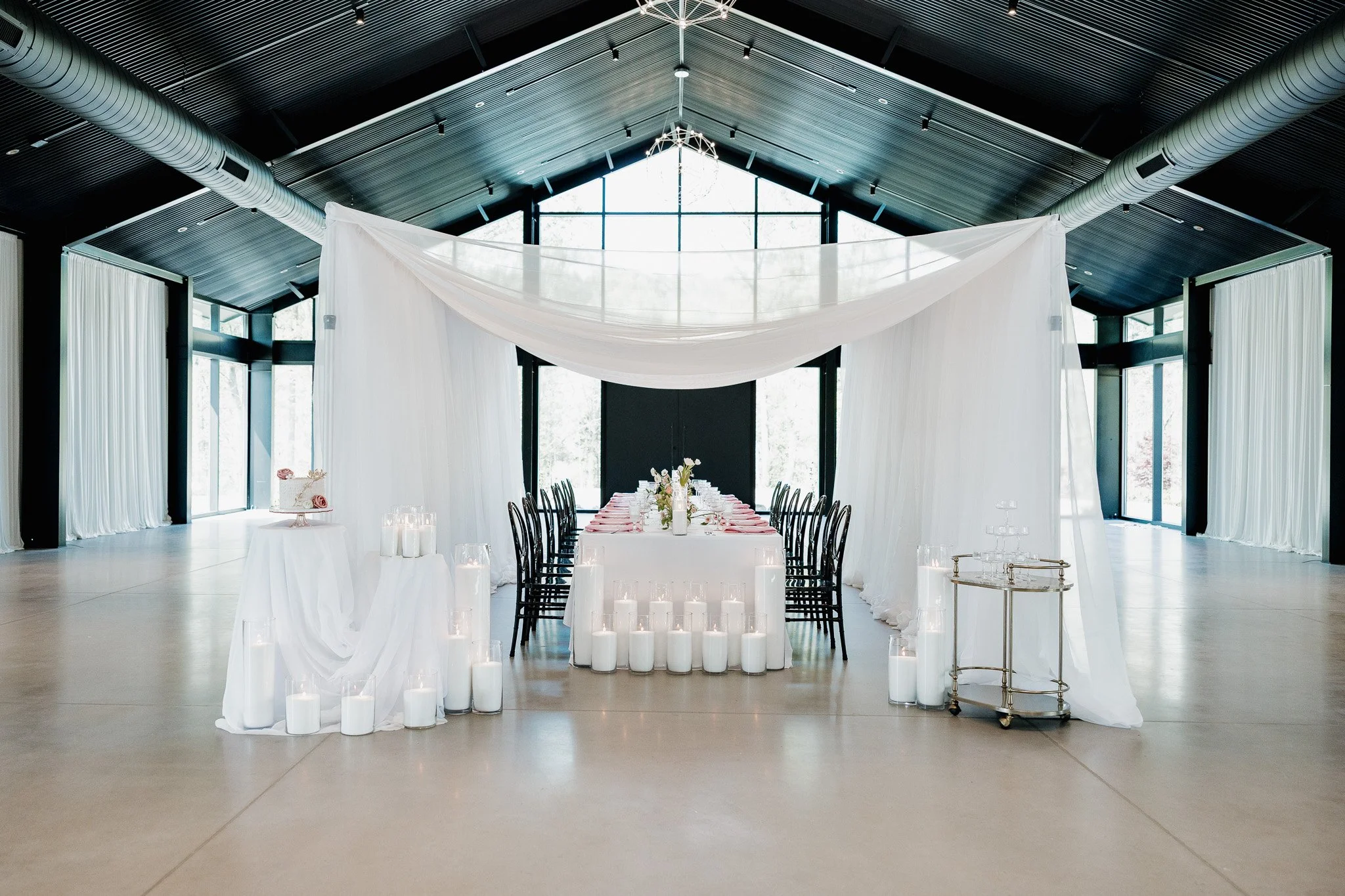 Elegant wedding reception setup with candles and florals at The Skyroom Wedding Venue North Carolina Wedding Photographer