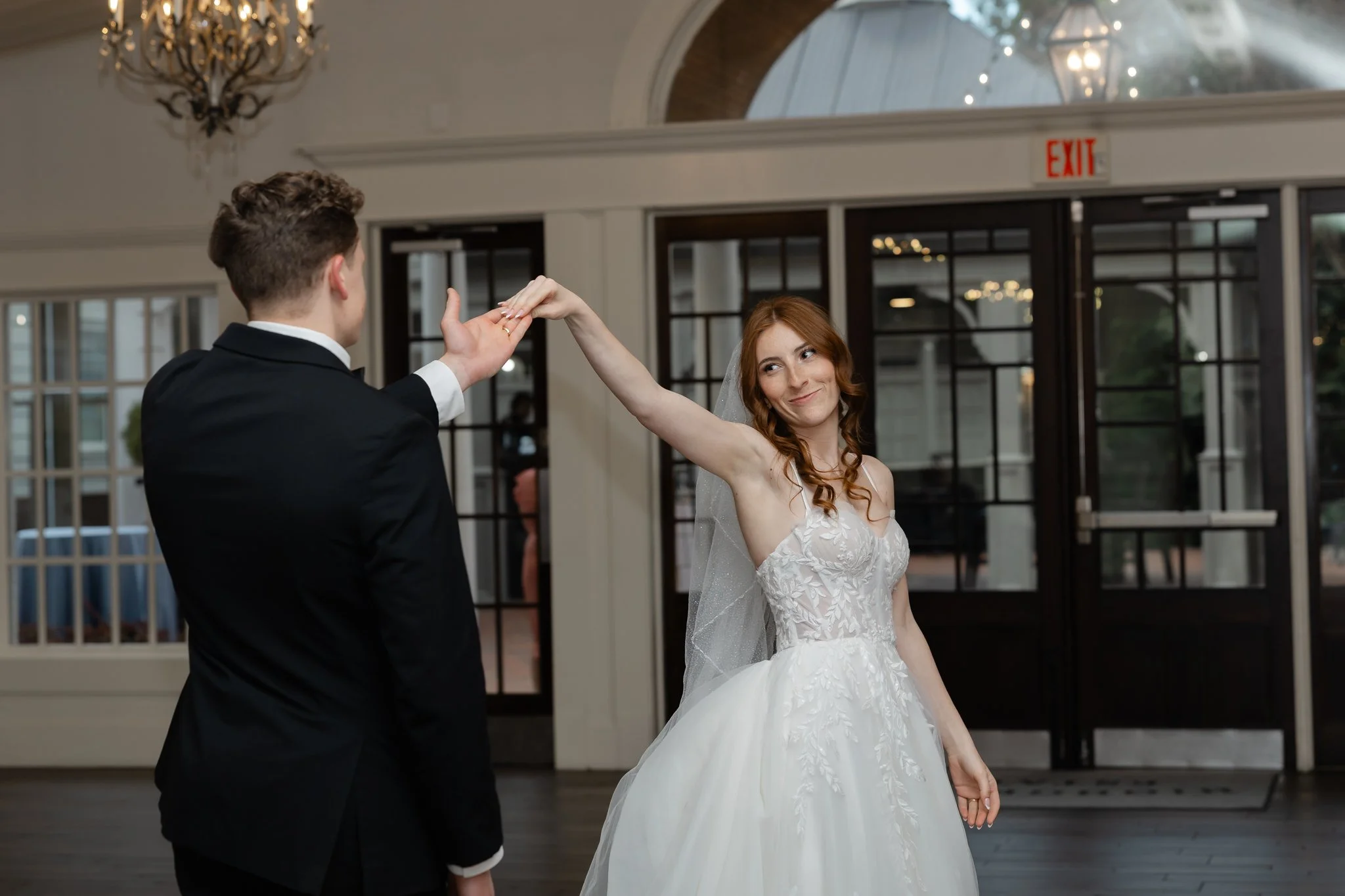 Bride and groom sharing their first dance at an elegant Highgrove Estate wedding reception