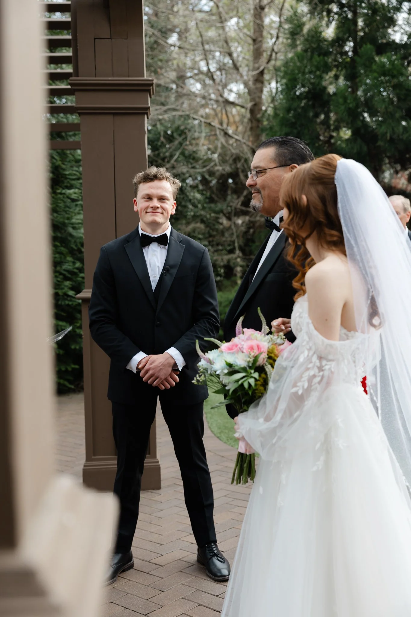 Groom's emotional reaction as he sees his bride for the first time on their wedding day