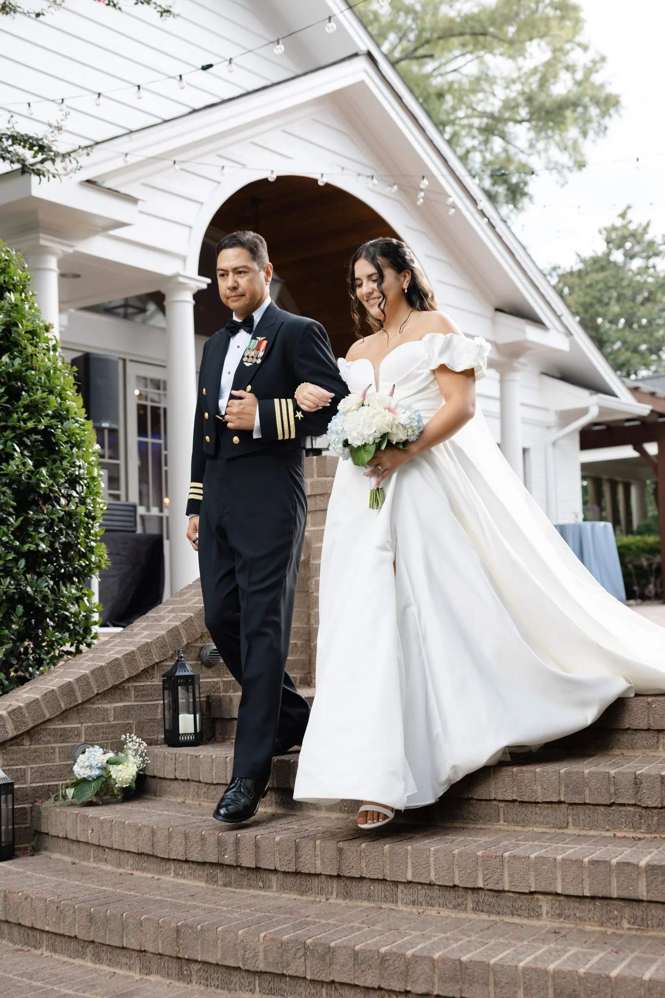 Bride walking down the aisle during a summer wedding at Highgrove Estate