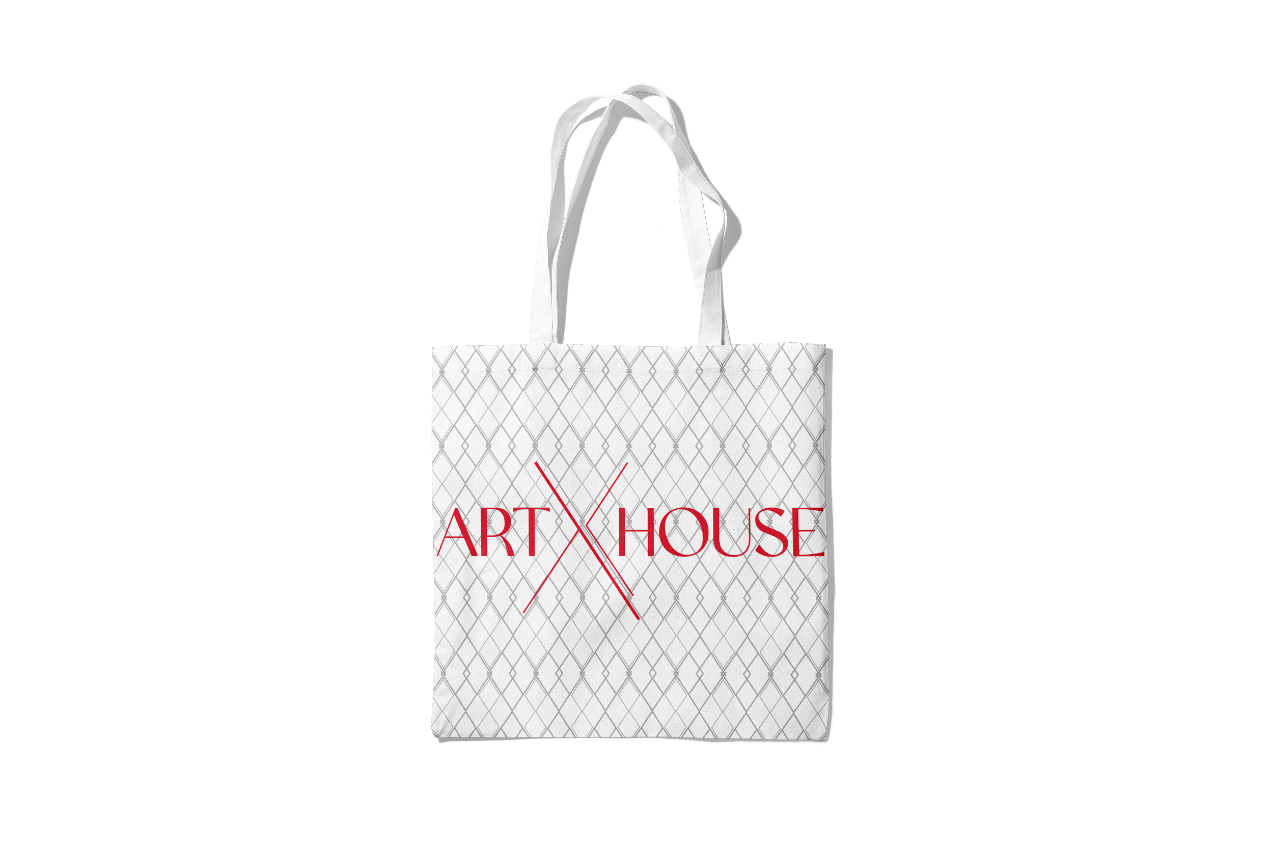 Shopping paper bag with a white lattice pattern and red text reading 'ART HOUSE', placed in front of a dark background with gray lighting.